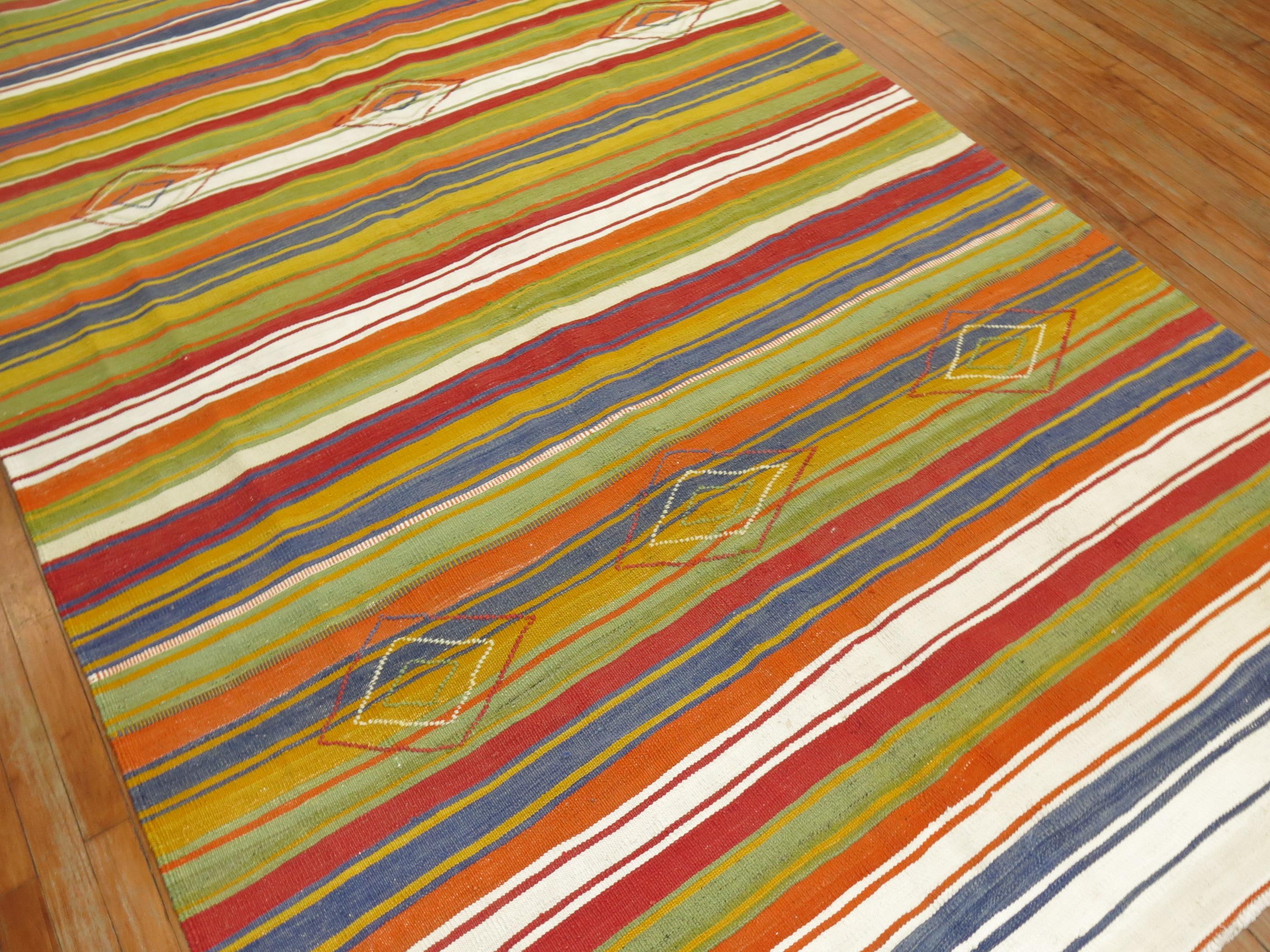20th century Turkish Kilim with a striped design in jolly rancher tones.