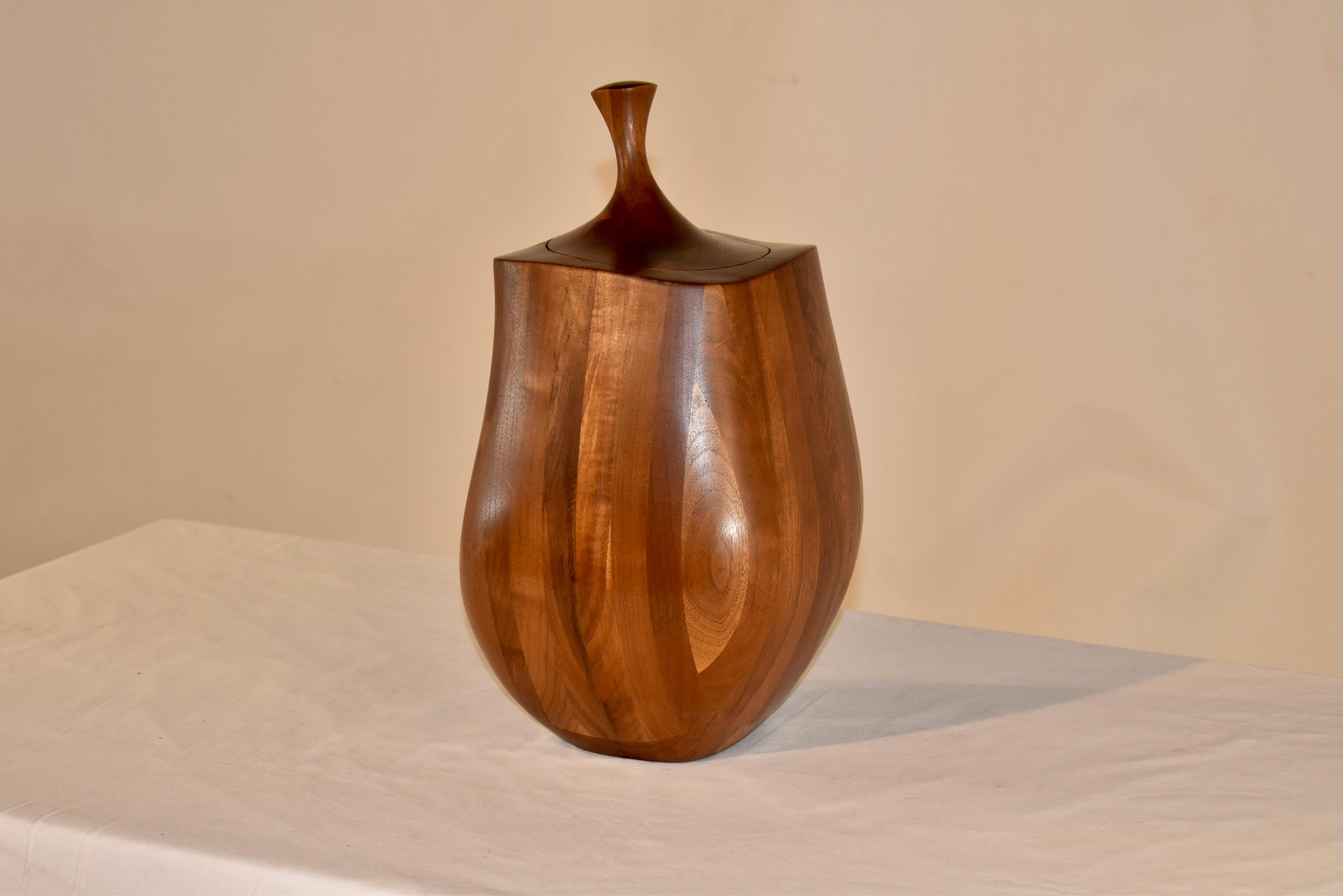 Sleek mid-century turned treen jar with lid.

The jar is made from mahogany and walnut and is uniquely shaped.  The wood has attained a gorgeous warm patina over the years and the shape makes it stand out with interest.

This will be a great