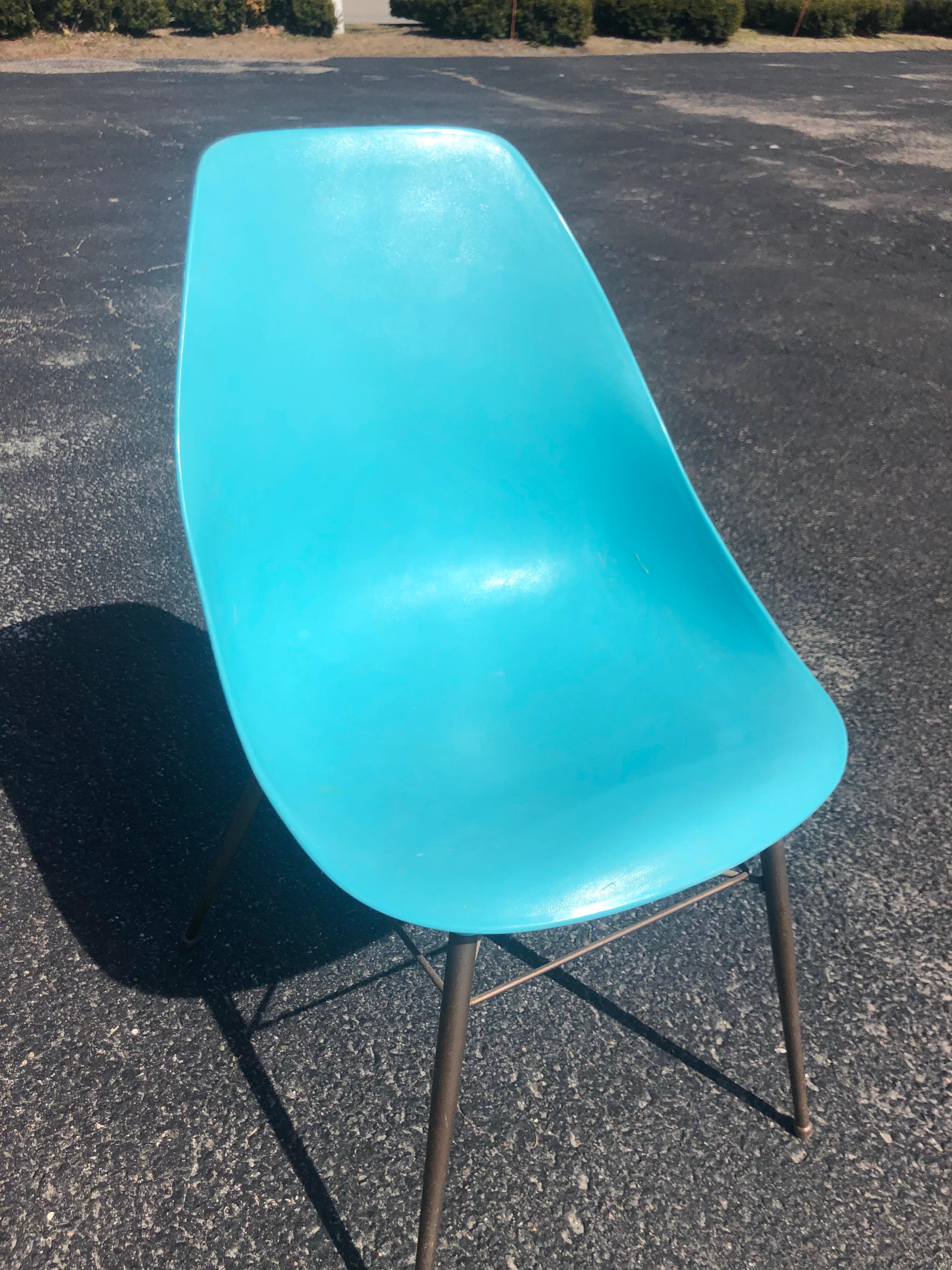 Mid century Turquoise shell chair. Fun pop of color. Perfect for a childs desk.