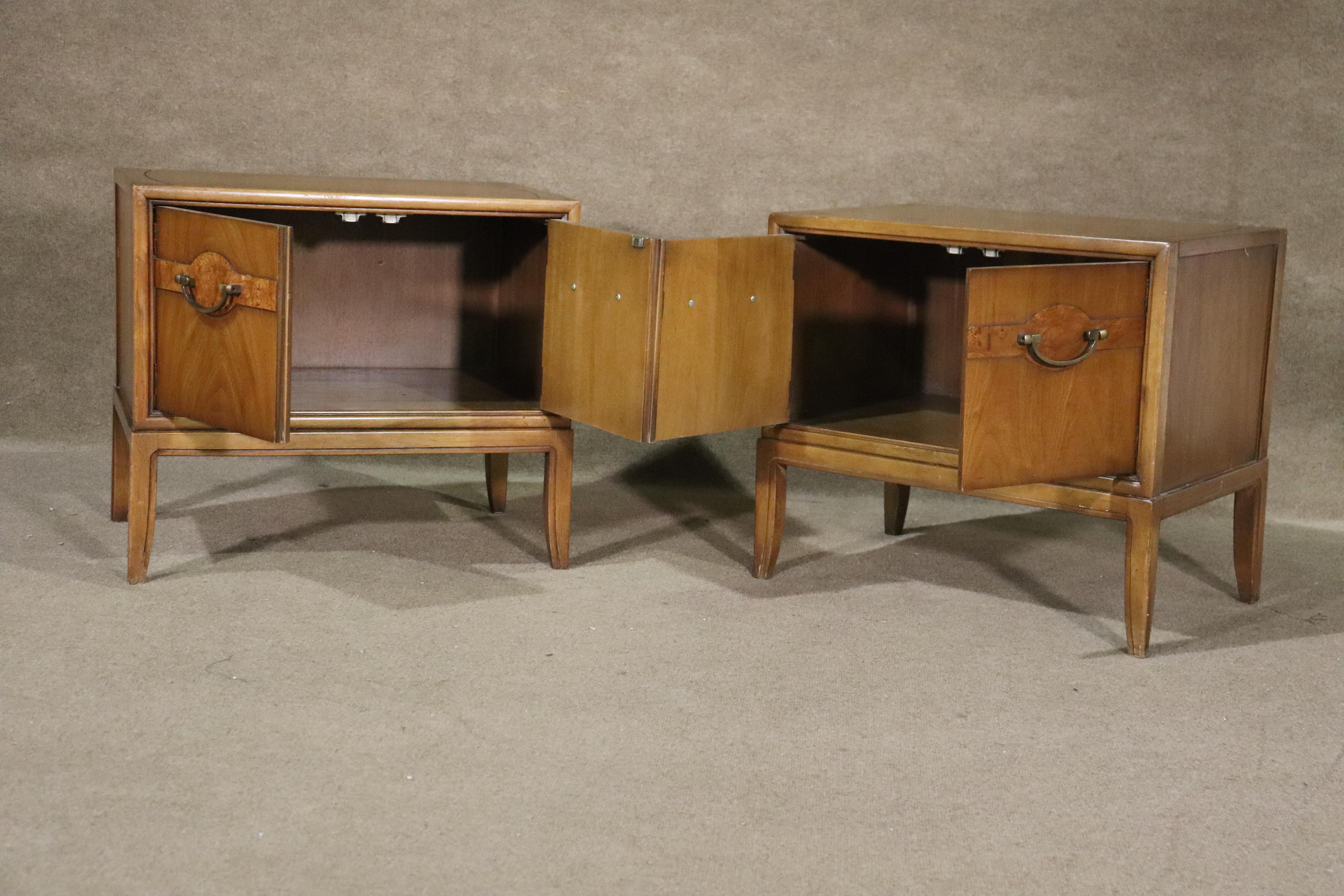 Pair of vintage modern end tables with two door cabinet storage. Warm walnut grain and brass hardware.
Please confirm location NY or NJ