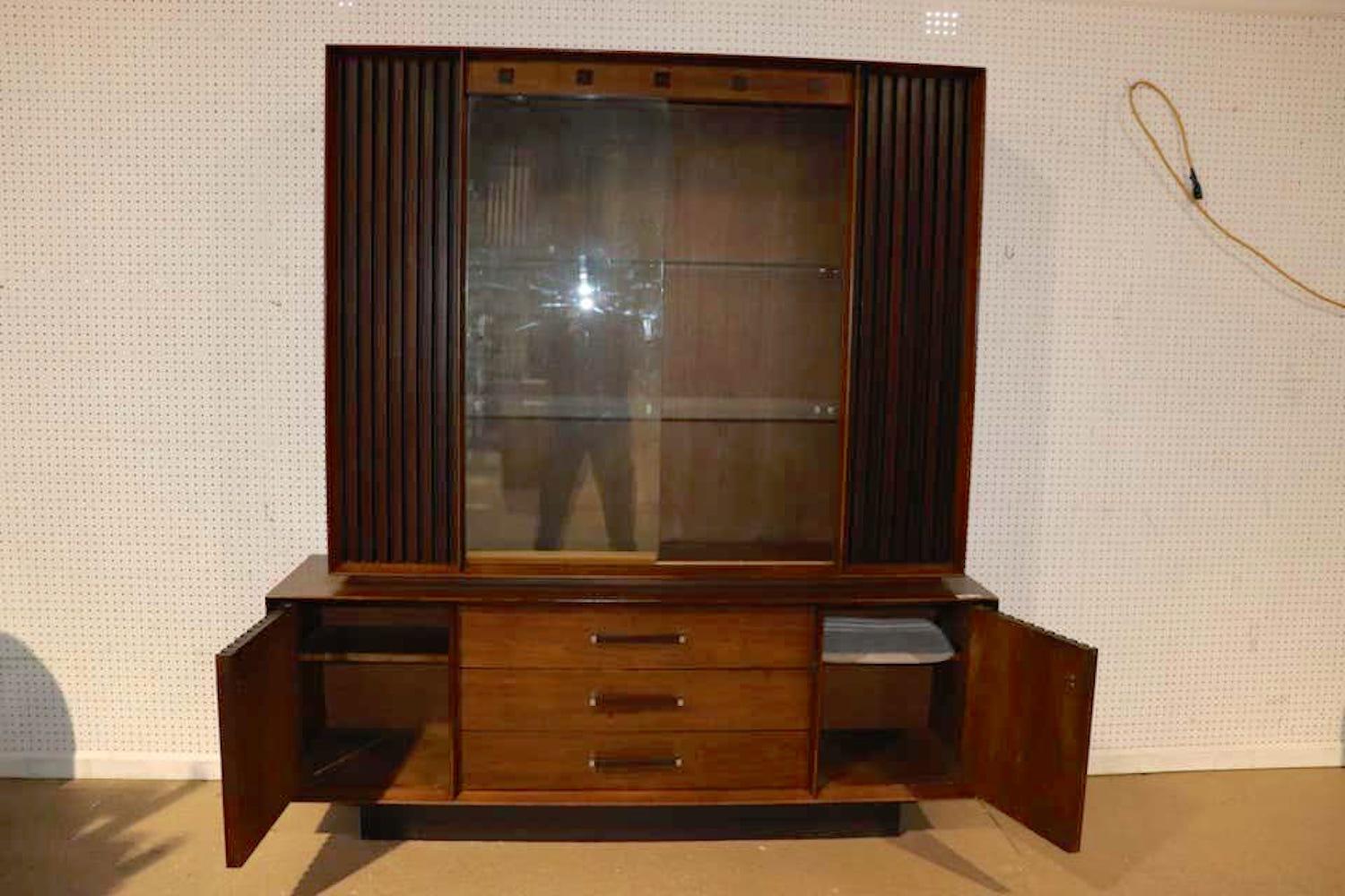 Large credenza with topper hutch unit by Lane. Rosewood and walnut combine with glass front doors for a stunning living room cabinet unit.
(Please confirm item location - NY or NJ - with dealer).
   