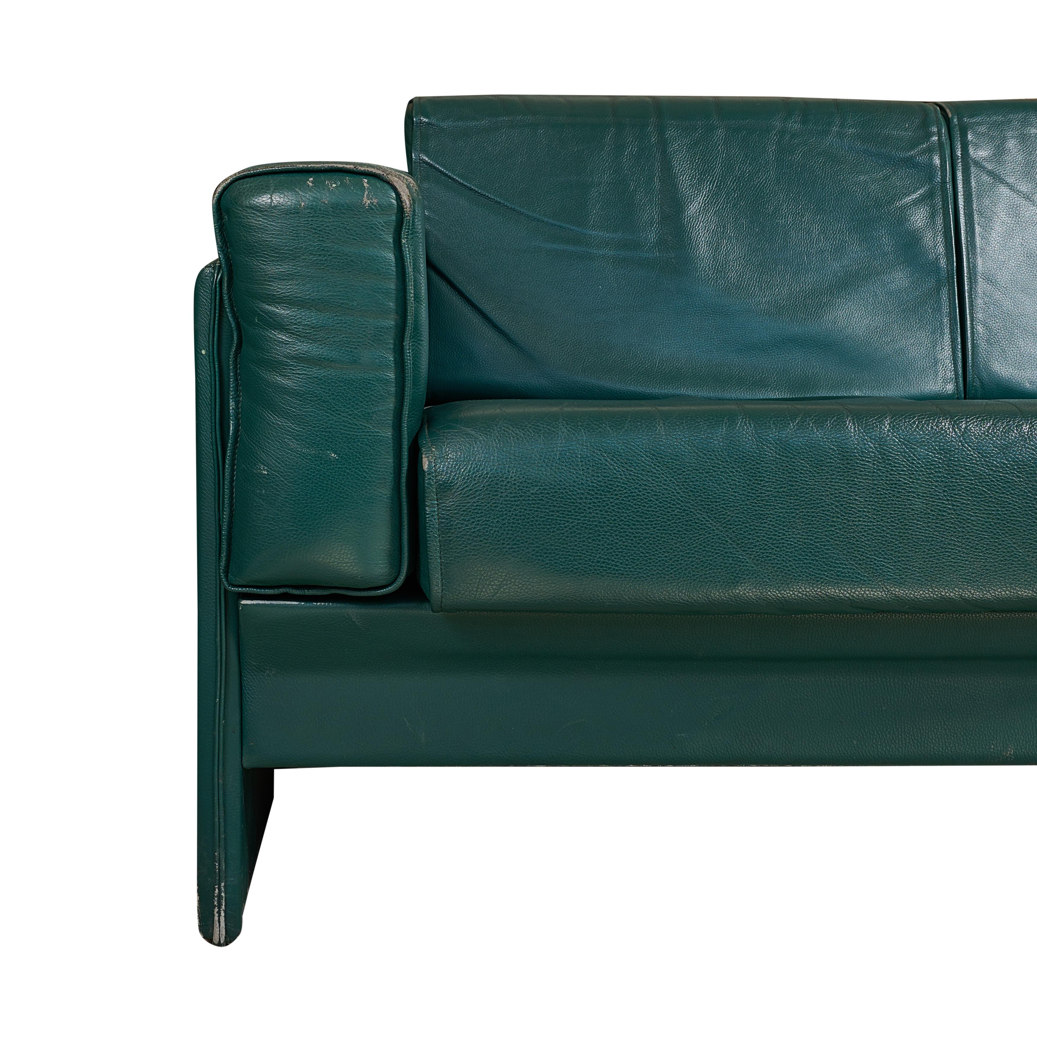 Midcentury, green leather, two seat sofa from a Milan airport.