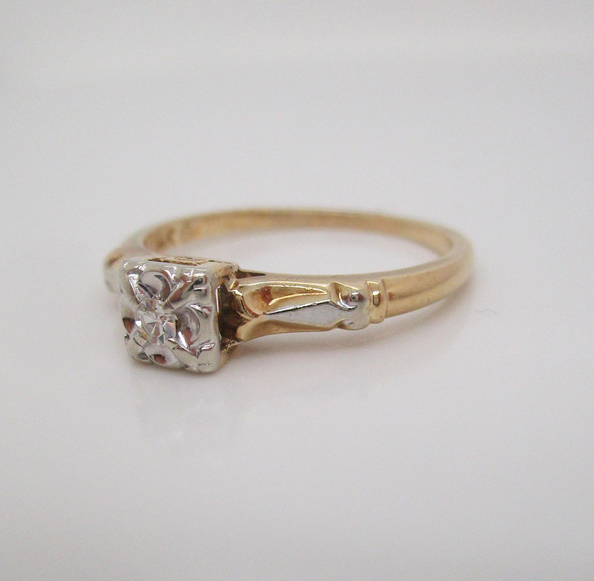 This is a beautiful mid-century engagement ring in 14k yellow and white gold with a brilliant white single cut diamond center stone! The ring has a classic mid-century look with a yellow gold shank and a bright white gold illusion head with an