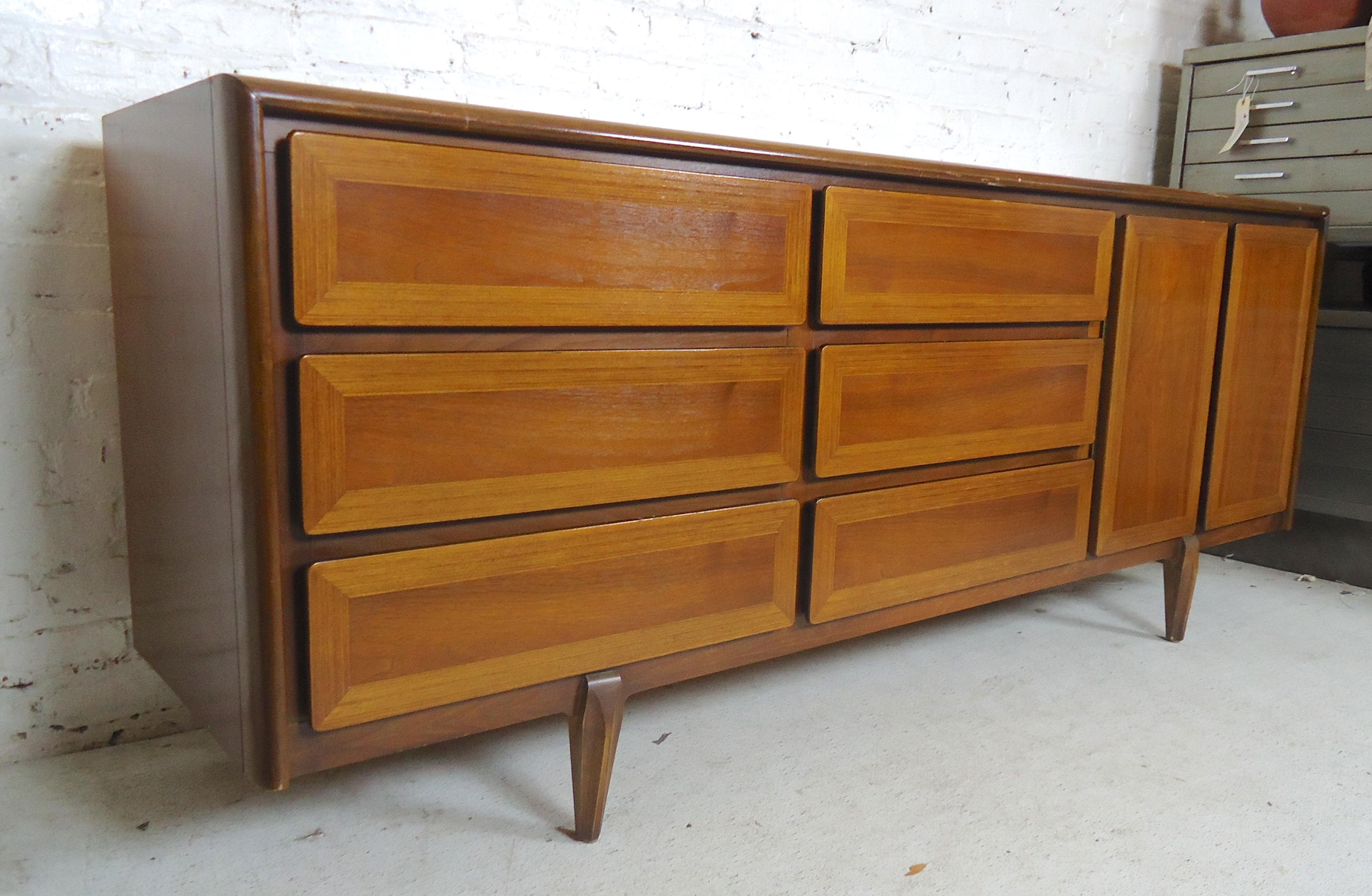 Long modern style dresser with nine drawers. Walnut wood with oak trim.
(Please confirm item location - NY or NJ - with dealer).    
   