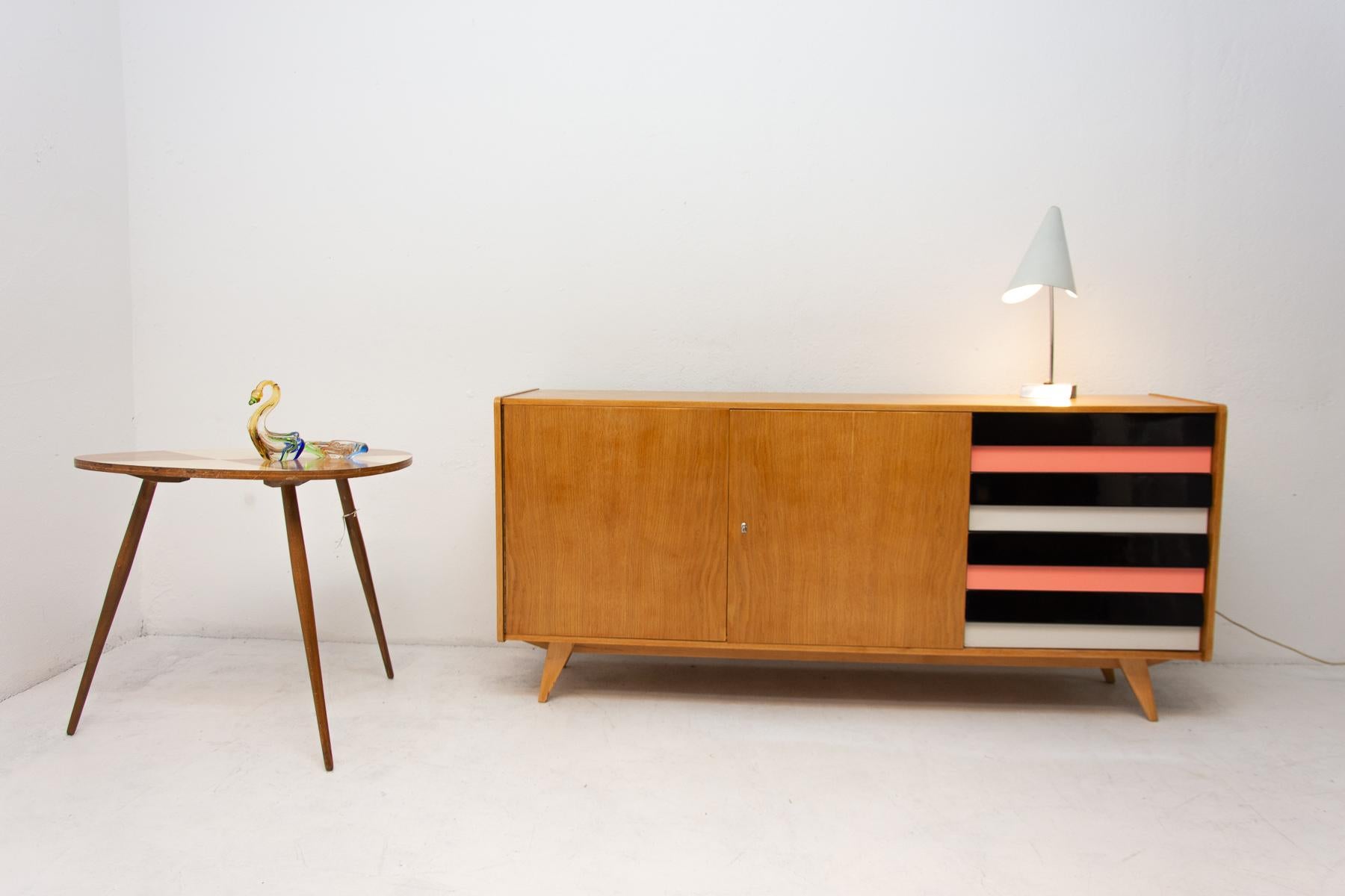 A popular vintage sideboard model U-460 from the 1960´s. It was designed by Jiri Jiroutek for Interier Praha. It features a beech wood, plywood, colored lacquered drawers. In excellent condition, fully refurbished.
   