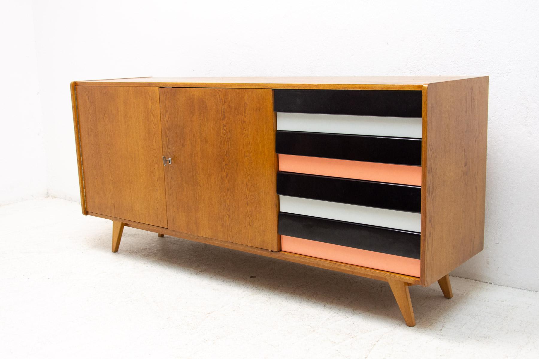 A popular vintage sideboard model U-460 from the 1960´s. It was designed by Jiri Jiroutek for Interier Praha. It features a beech wood, plywood, colored lacquered drawers. In very good condition.

Measures: Height: 76 cm, lenght: 165 cm, depth: 45