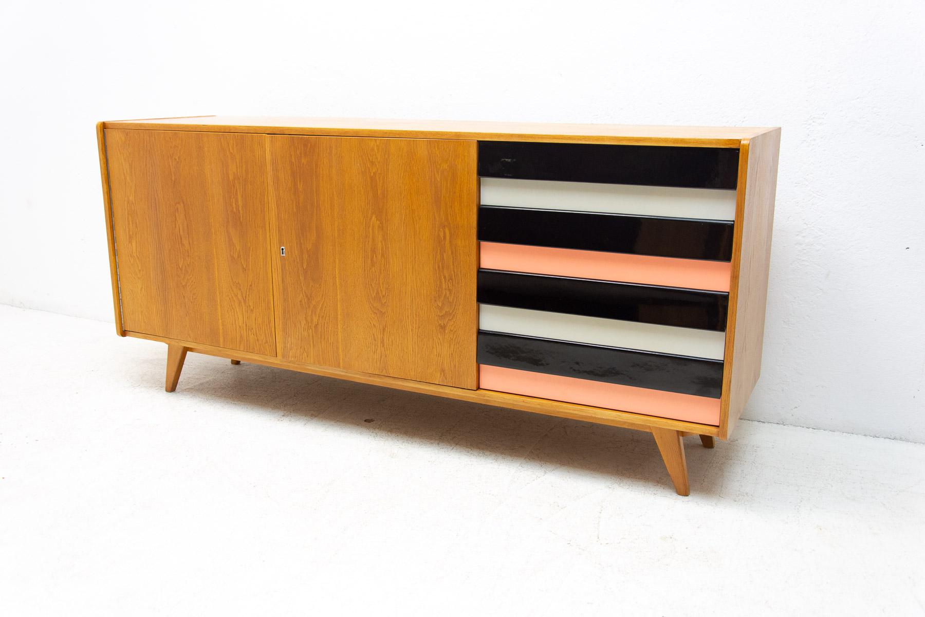 A popular vintage sideboard model U-460 from the 1960´s. It was designed by Jiri Jiroutek for Interier Praha. It features a beech wood, plywood, colored lacquered drawers. In very good condition, fully renovated.

Measures: height: 76 cm, length: