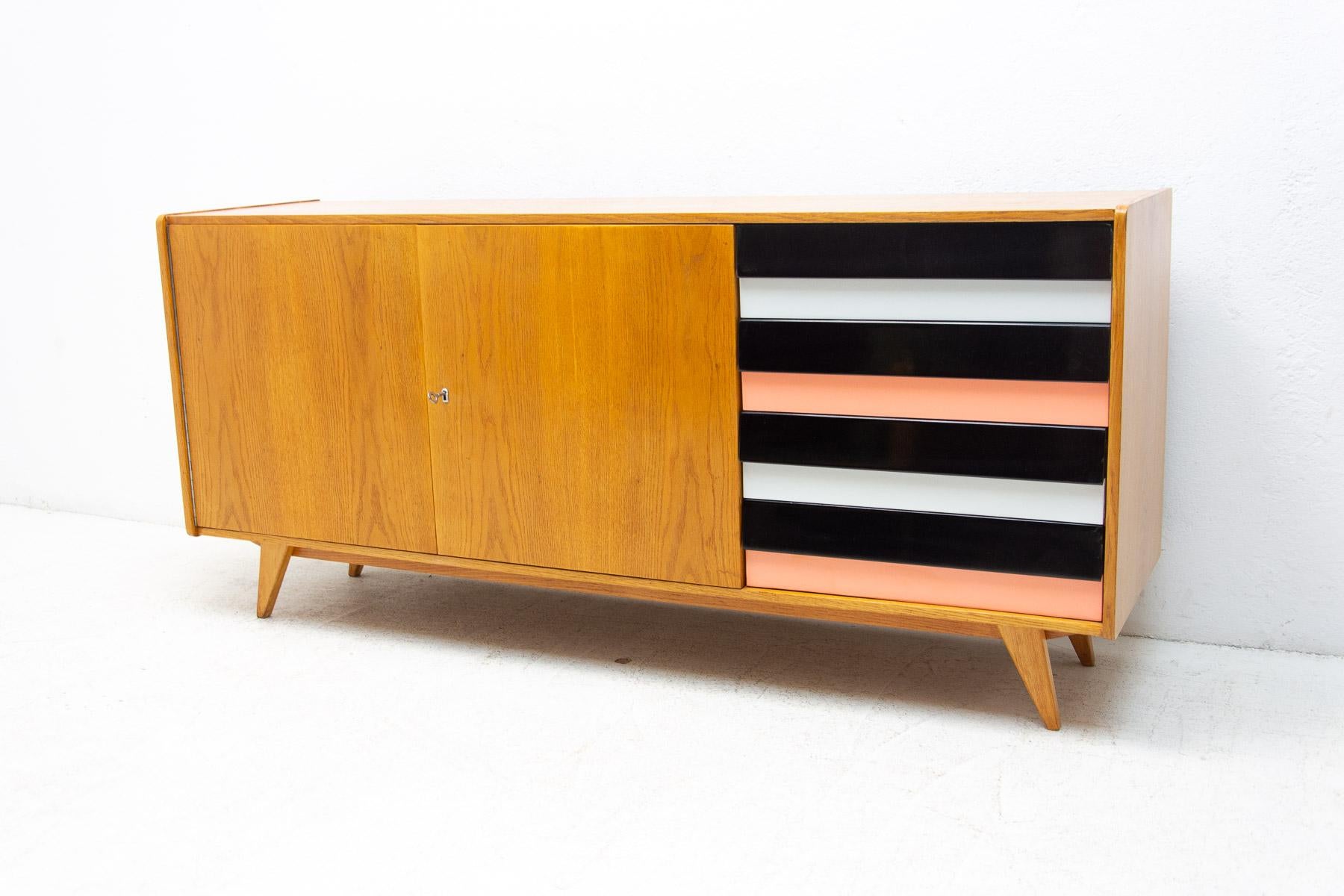 A popular vintage sideboard from the 1960s. It was designed by Jiri Jiroutek for Interier Praha. It features a Beechwood, plywood, colored lacquered drawers. In very good condition, fully renovated.

Measures: Height: 76 cm, lenght: 165 cm, depth: