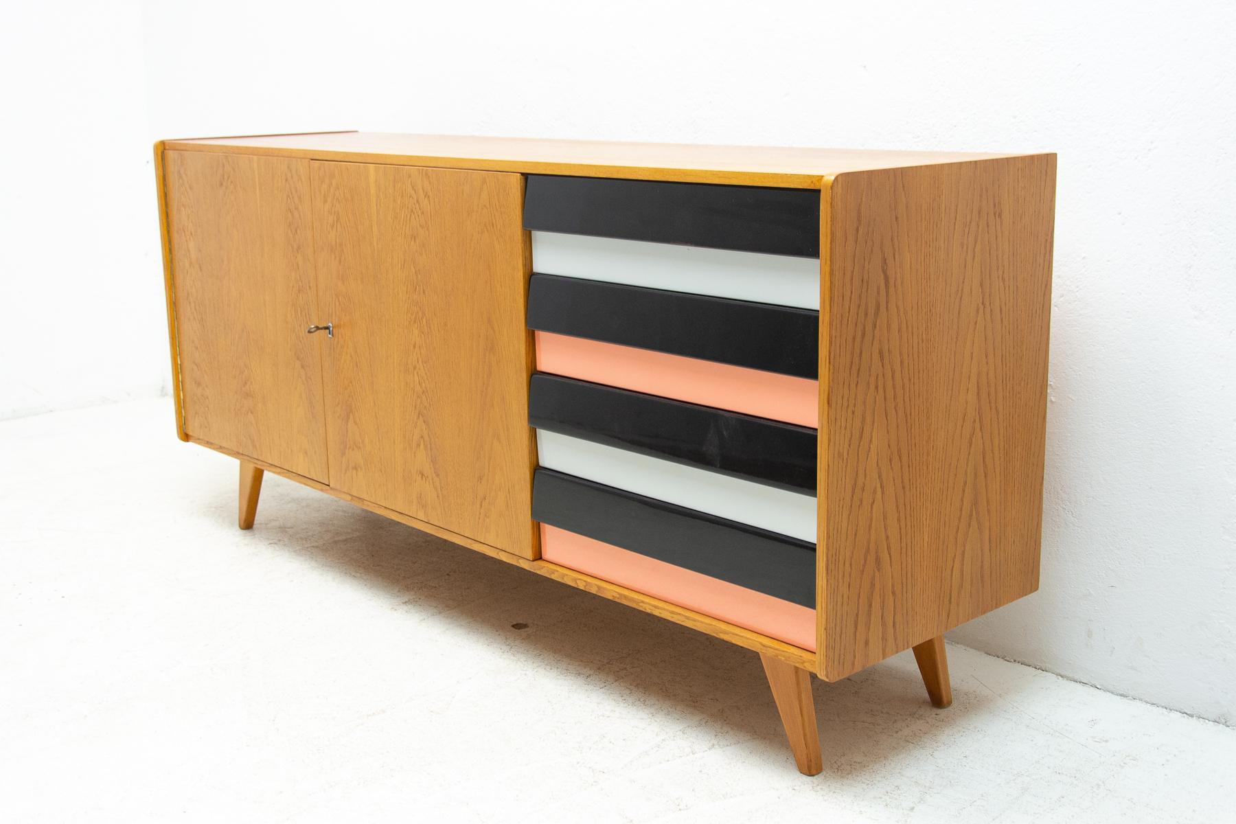 A popular vintage sideboard model U-460 from the 1960´s. It was designed by Jiri Jiroutek for Interier Praha. It features a beechwood, plywood, colored lacquered drawers. In very good condition, fully renovated.

Measures : Height: 77 cm, lenght: