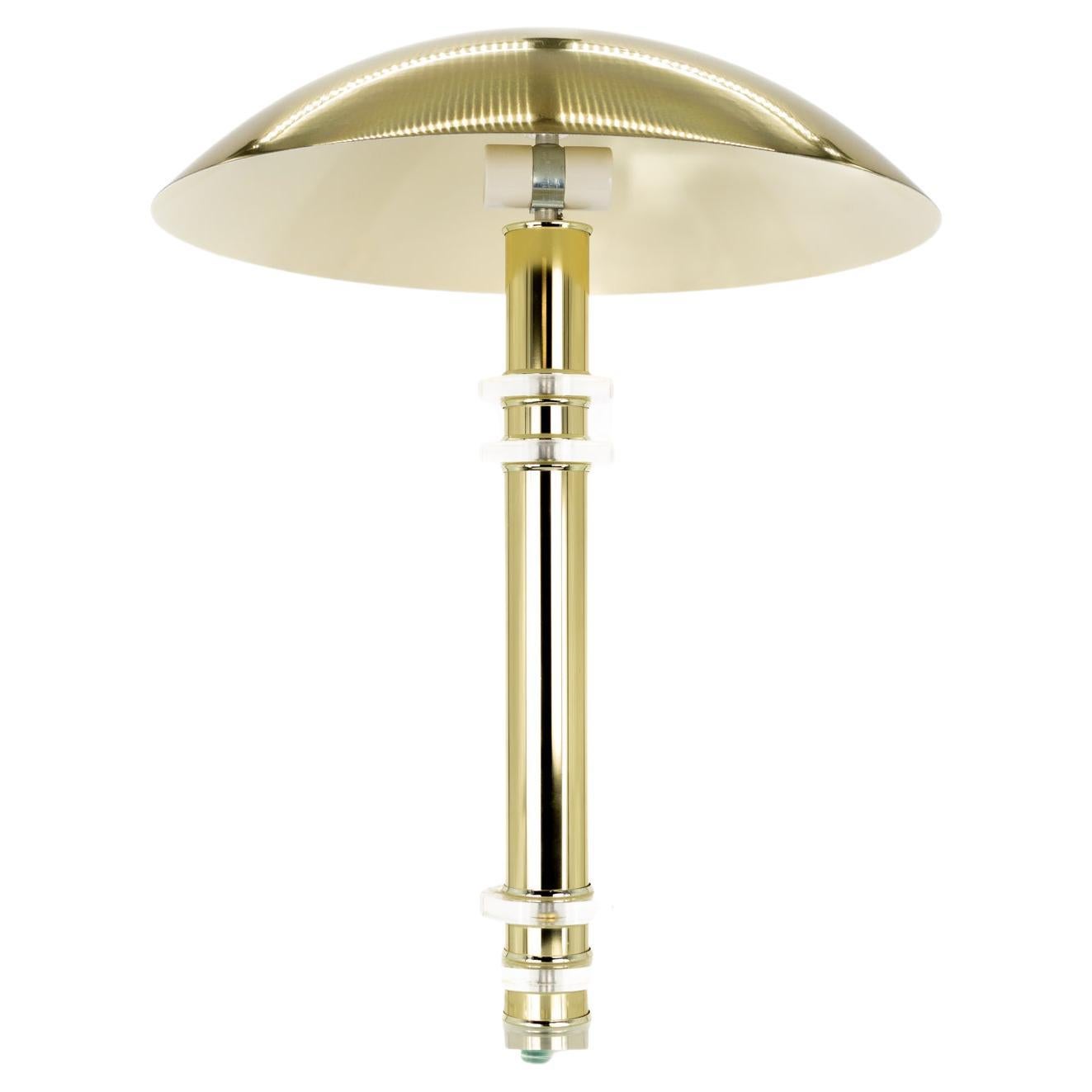 Mid Century UFO Brass and Lucite table lamp with aluminum dome shade

This lamp measures: 19 wide x 19 deep x 25 inches high and weighs 9.3 pounds

Excellent vintage condition

We take our photos in a controlled lighting studio to show as much
