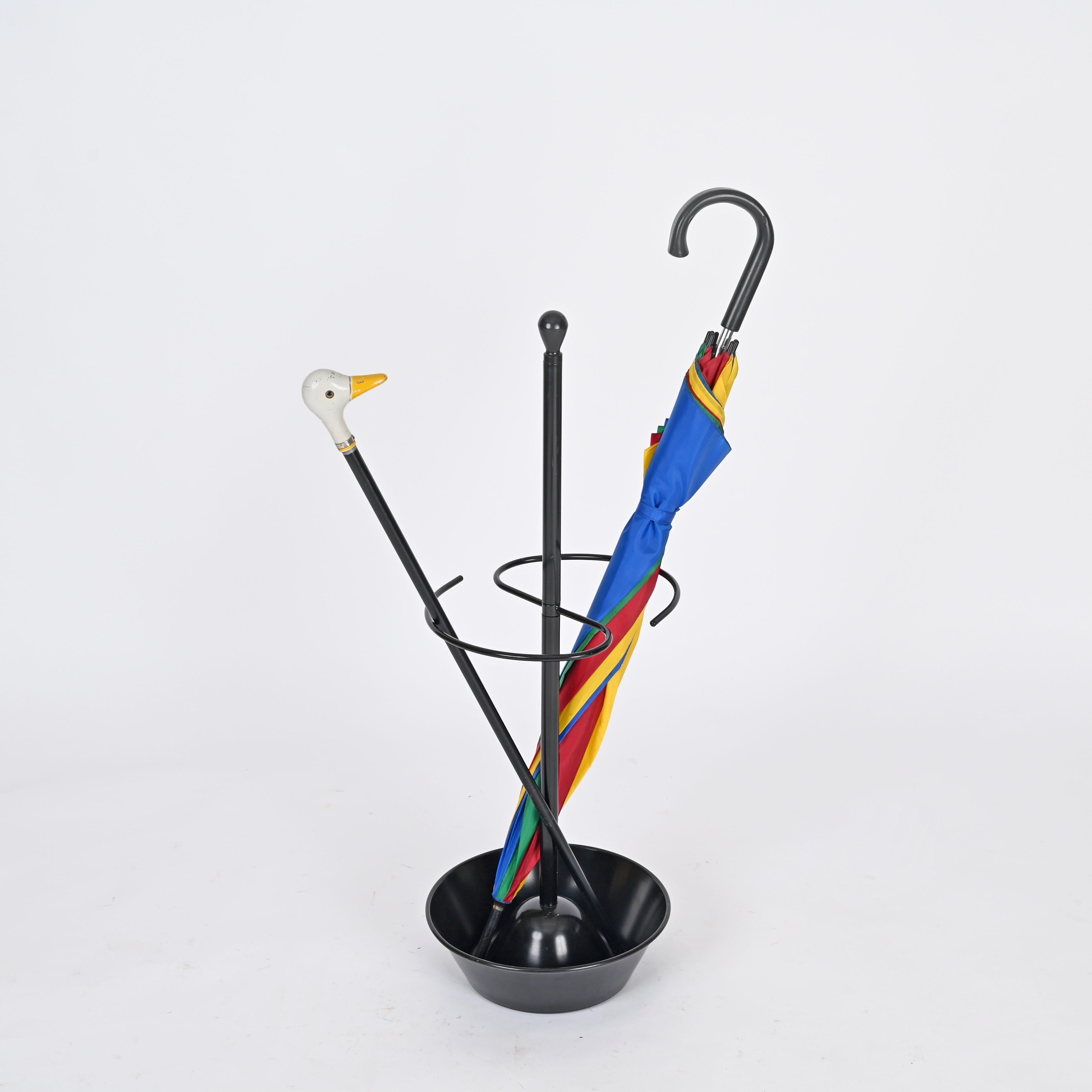 Wonderful umbrella stand in black enameled metal designed by Achille and Pier Giacomo Castiglioni and produced by Zanotta in 1957. The umbrella stand is in perfect condition and is signed on the bottom. 

An icon of Italian design, this umbrella is