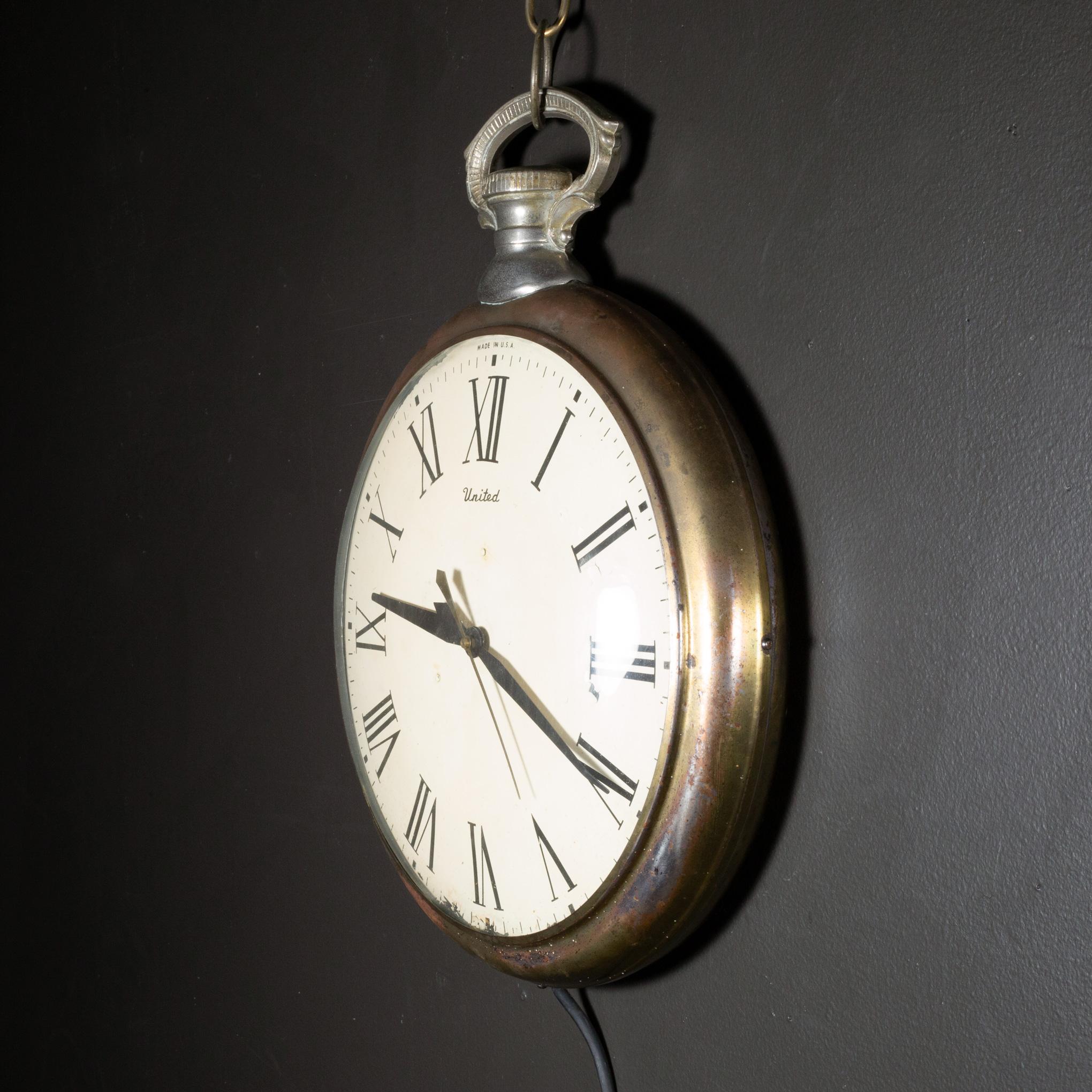 ABOUT

An original United Clock Company oversize brass pocket watch hanging clock. The clock features a white clock face with black lettering, curved glass front, long brass chain and plug in cord. Marked 