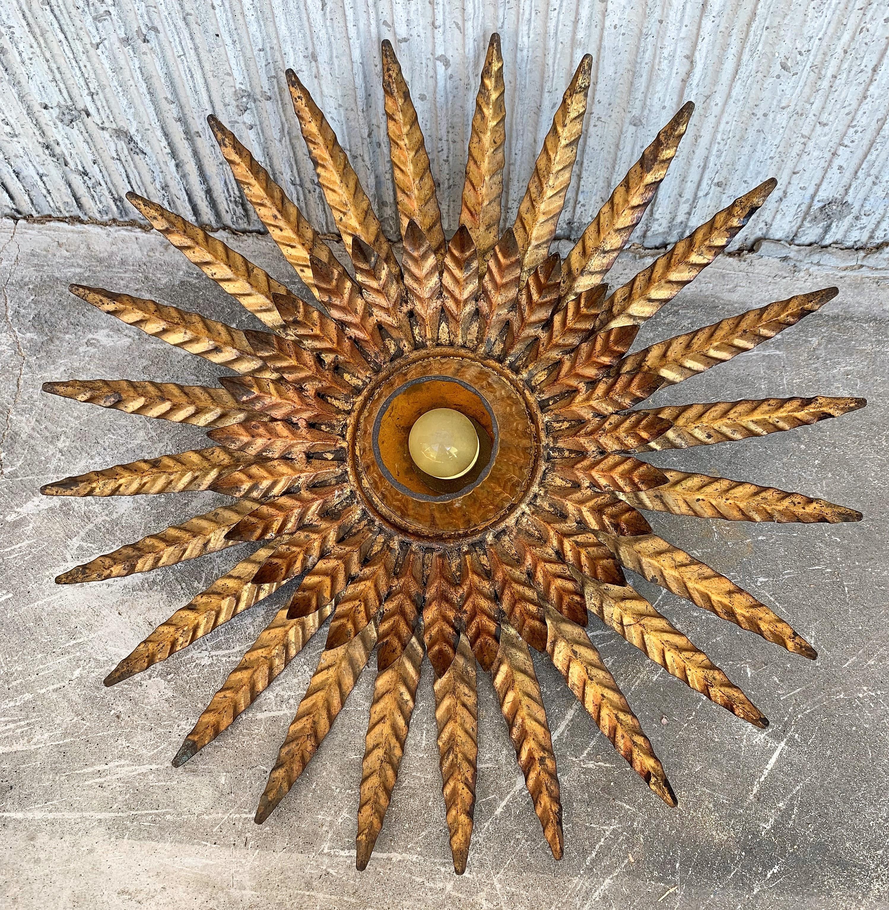 Midcentury unusual sunburst ceiling fixture with glass tulip.