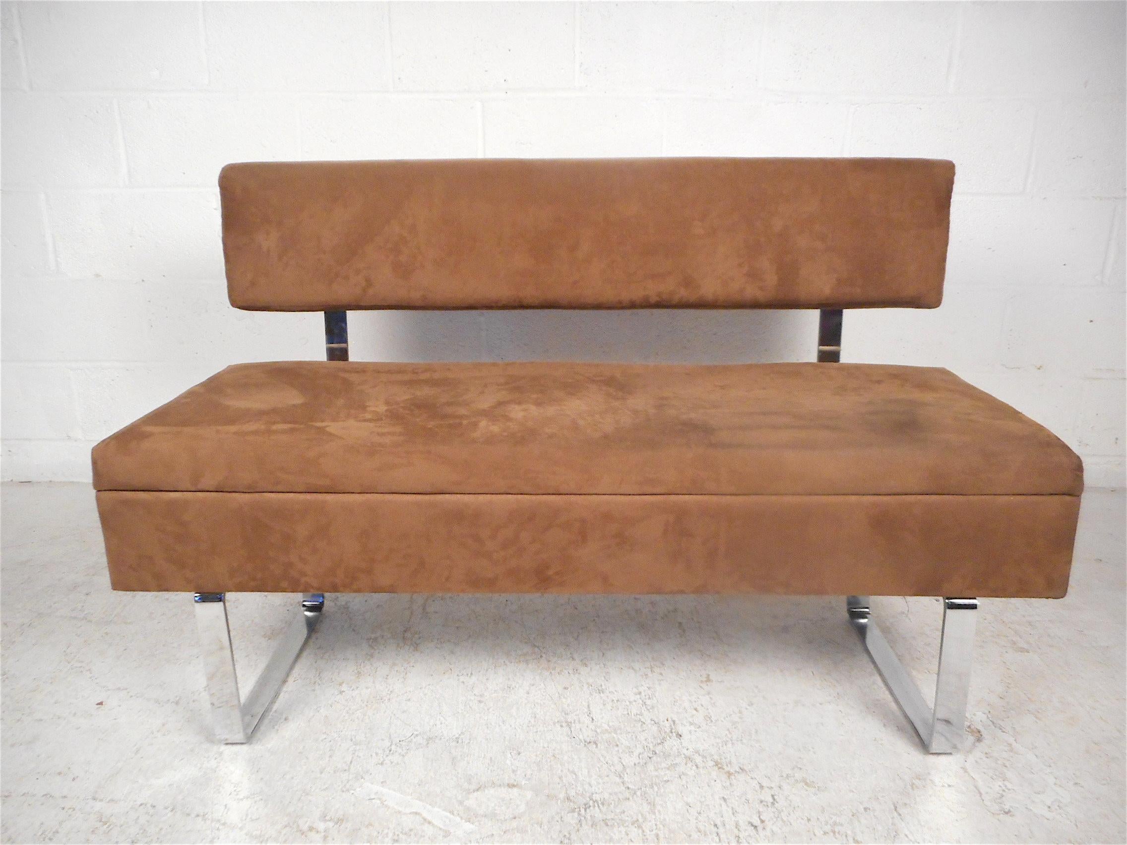 Stylish midcentury bench with upholstered seating and backrests, plus sleek chrome supports and sled legs. The bench's seat lifts up to reveal a storage compartment. A nice mix of style and utility, this bench is sure to please in any modern