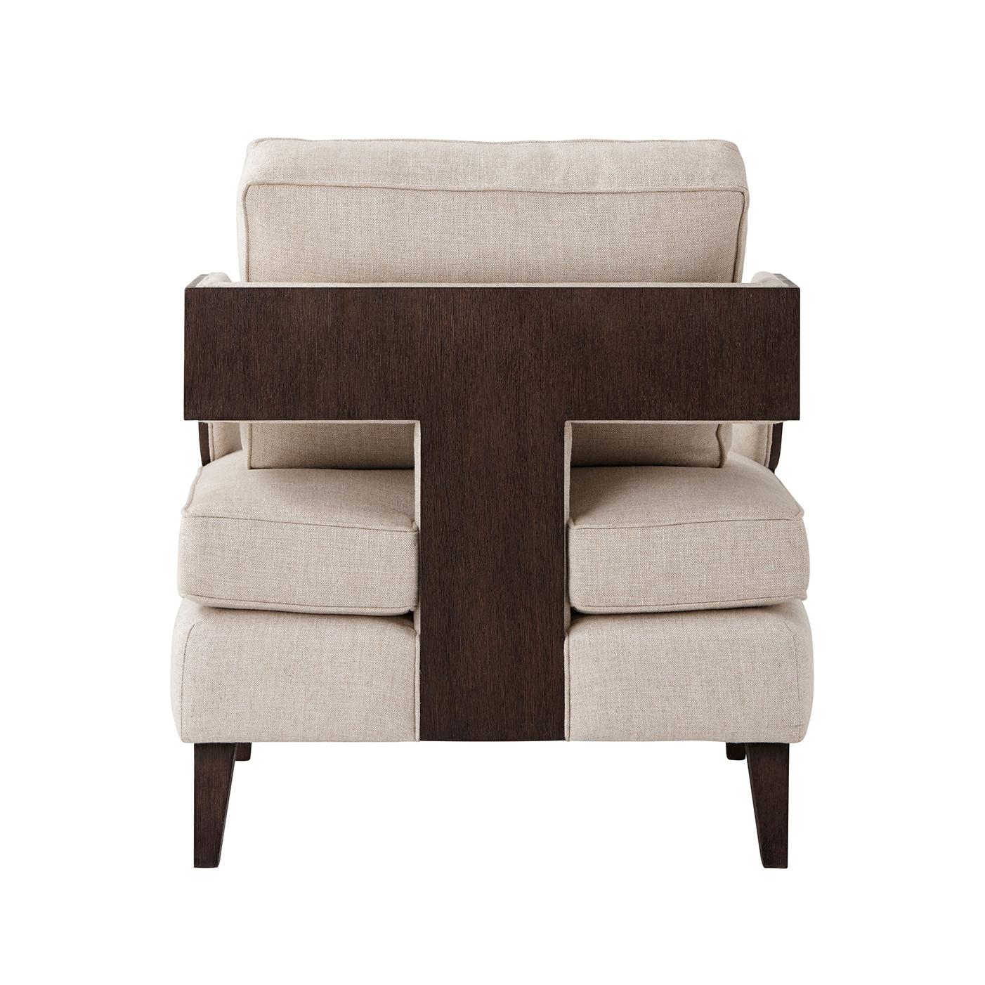 A Mid-Century Modern style upholstered club chair with loose cushion back and seat with our textured veneer outside frame and square tapered legs.

Dimensions: 31