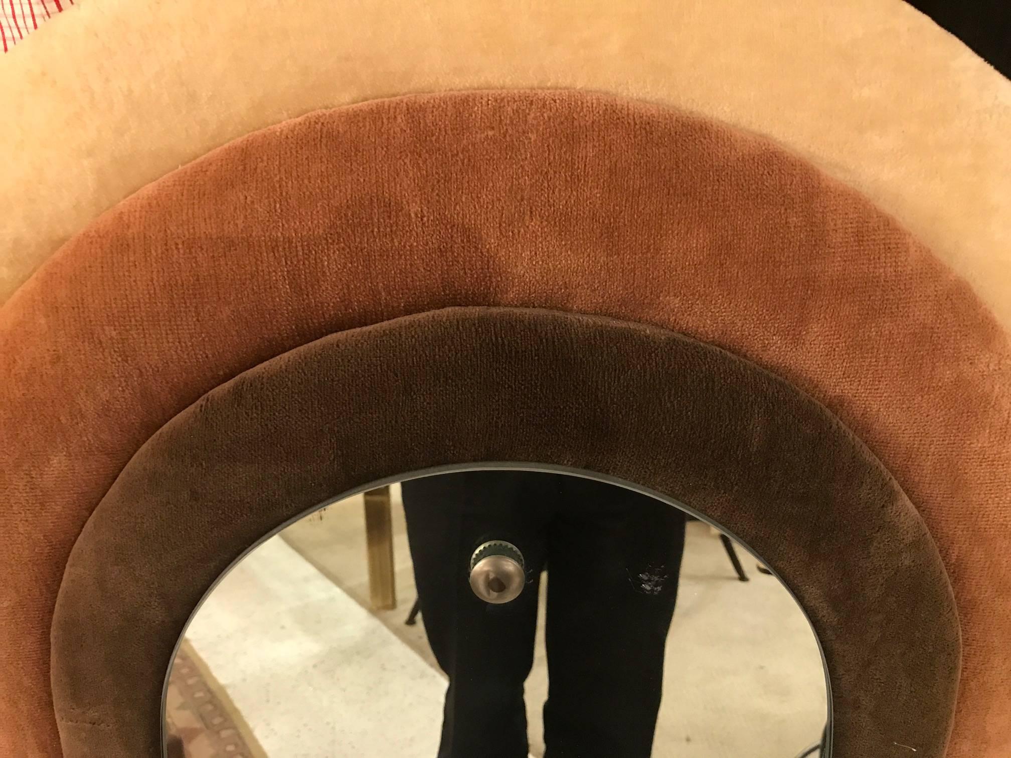 An upholstered frame mirror with chrome mounts. Iconic mid-1970s style with cotton velvet triple layer arched frame with arched mirror.