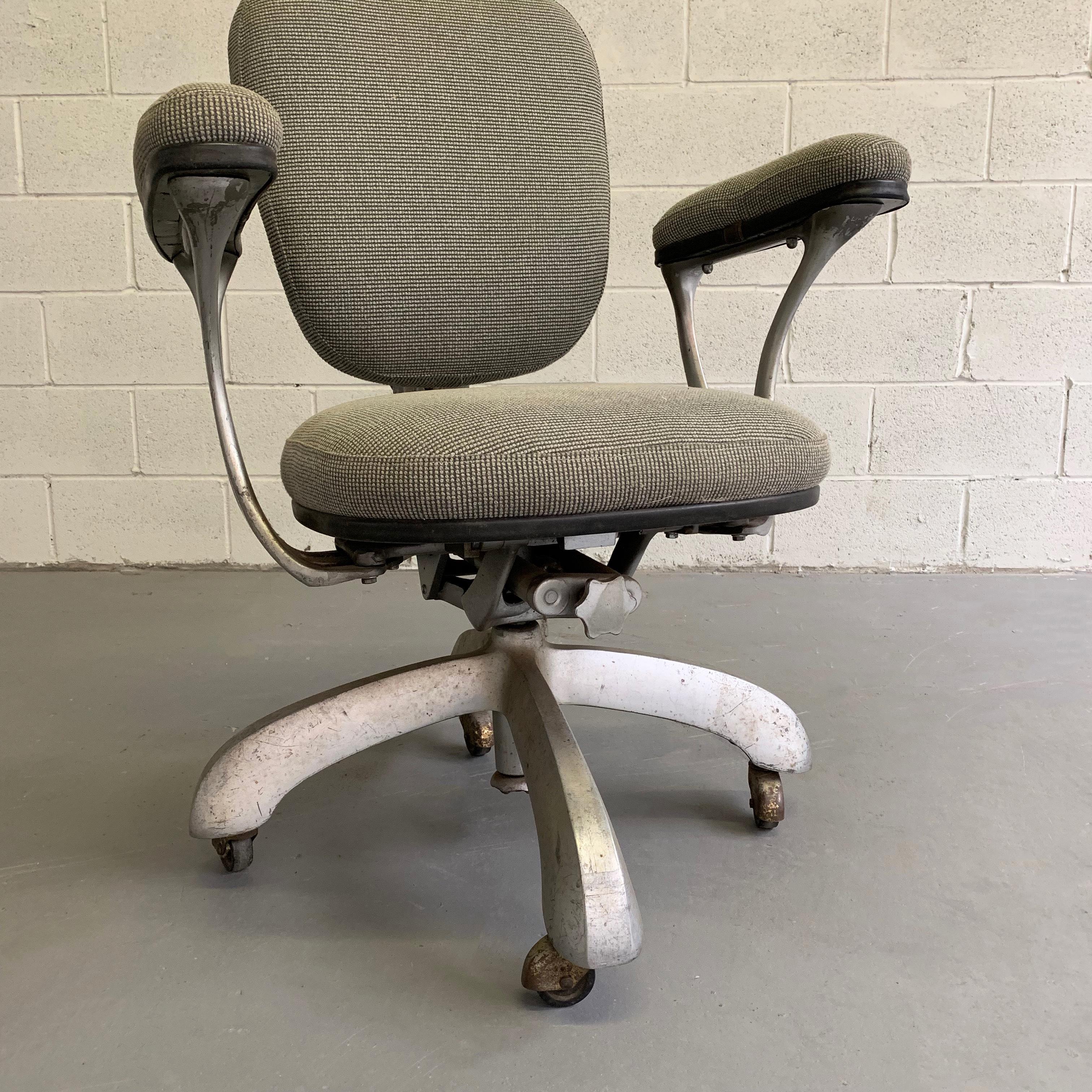 Mid-Century Modern, office armchair features a rolling, height adjustable steel frame with newly upholstered seat and back.