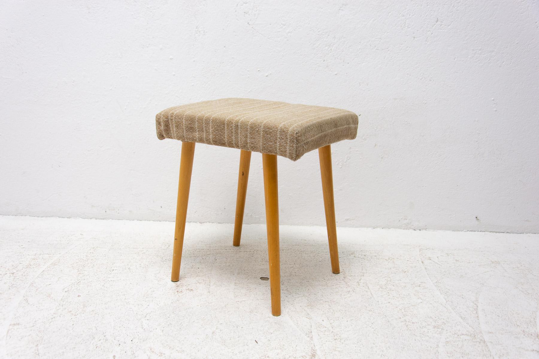 This stool / footrest was made in the former Czechoslovakia in the 1960's.

It's made of beech wood and it's upholstered in fabric. In good condition, shows slight signs of age and using.

Measures: height: 45 cm

Width: 40 cm

Depth: 34