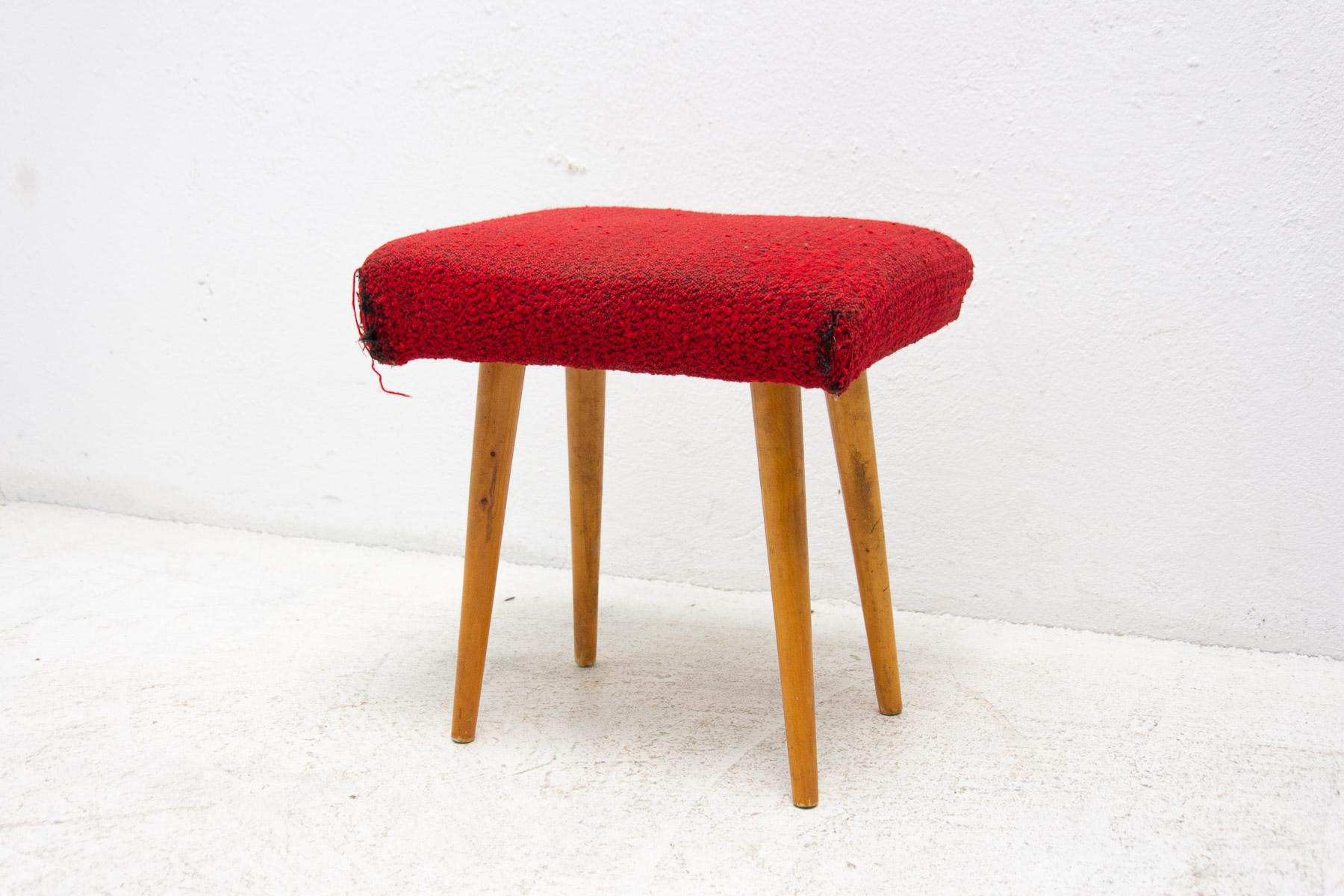 This stool/footrest was made in the former Czechoslovakia in the 1960´s.

It´s made of beech wood and it´s upholstered in fabric. Showing signs of age and using, the fabric is torn in the corners, but it is possible to sew it up.

Measures: