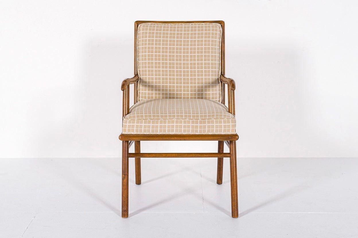This lovely vintage mid century modern arm chair was designed by T.H. Robsjohn-Gibbings (English, 1905-1976) for Widdicomb circa 1950. The elegant, distinctive design features clean, minimalist lines and gentle curves. The chair is beautifully