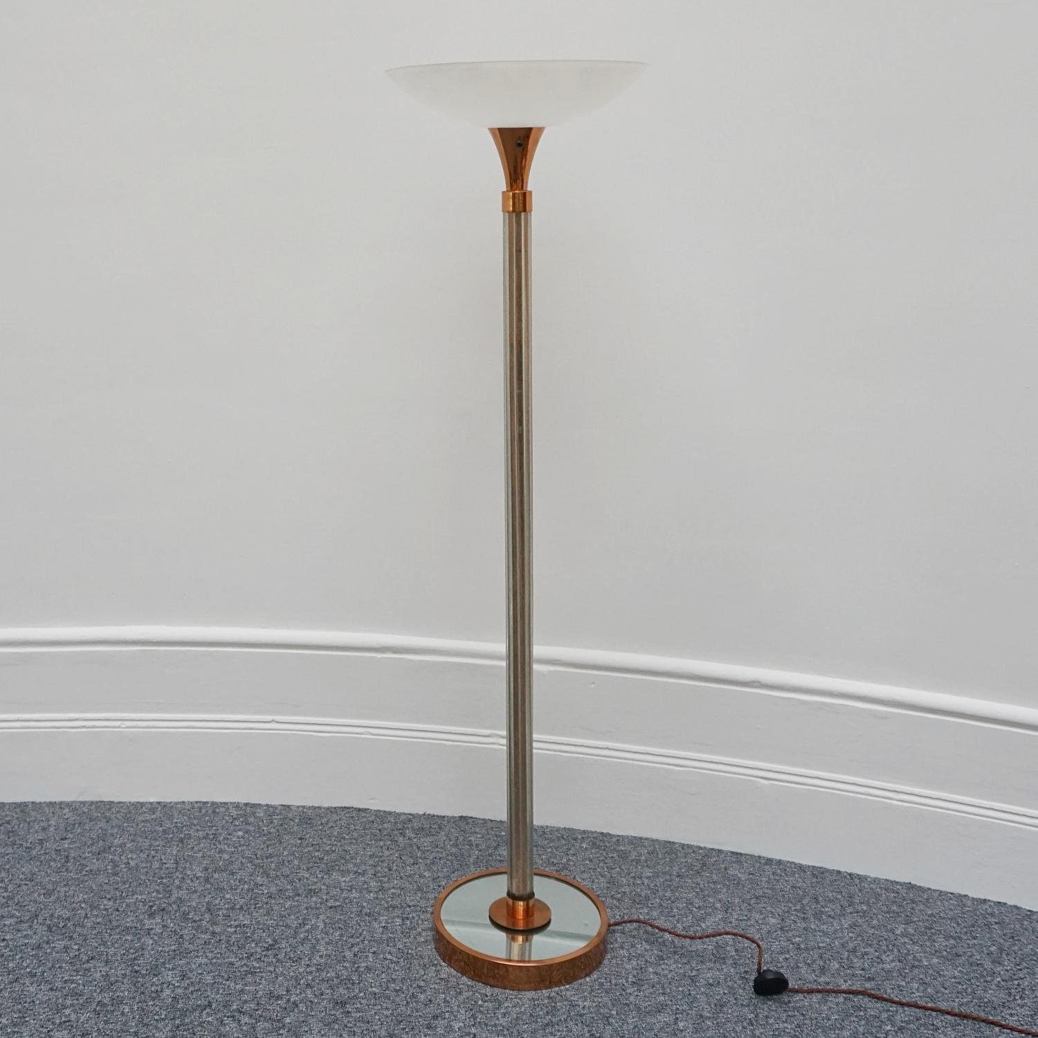A mid-century uplighter attributed to Heal's of London. Copper base with mirrored glass surround and copper upper stem connected by clustered glass rods. Original plastic shade. 

Dimensions: H 174cm, W 48cm, D 48cm 

Origin: English

Date: