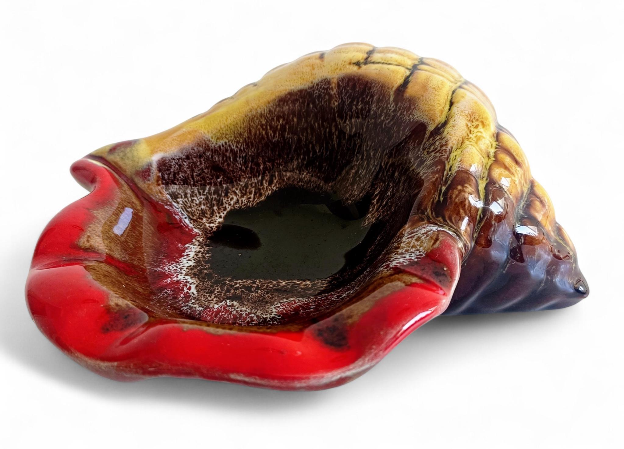 Mid-Century Vallauris “Sea Shell” Vide-Poche / Catchall – Red, Brown & Yellow Ceramic

A very beautiful Vallauris “céramique” vide-poche or catchall, sculpted in the form of a sea horn shell. The piece features a striking color palette of red,