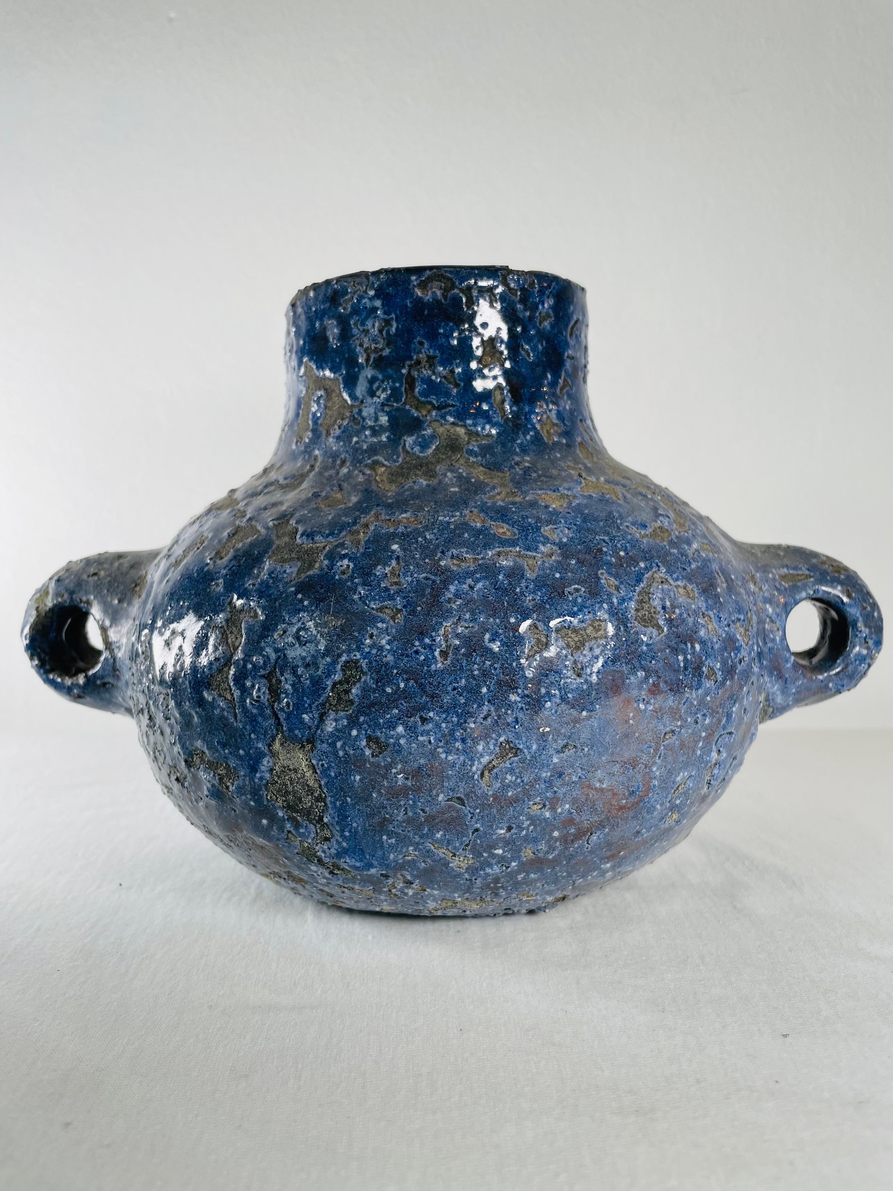 Vase with two handles in blue and black ceramic worked like lava. Handmade in Vallauris in the south of France by the artist Albert Thiry. Originally from Nice, the Thiry family settled in the famous village of potters in Vallauris in 1943.

After