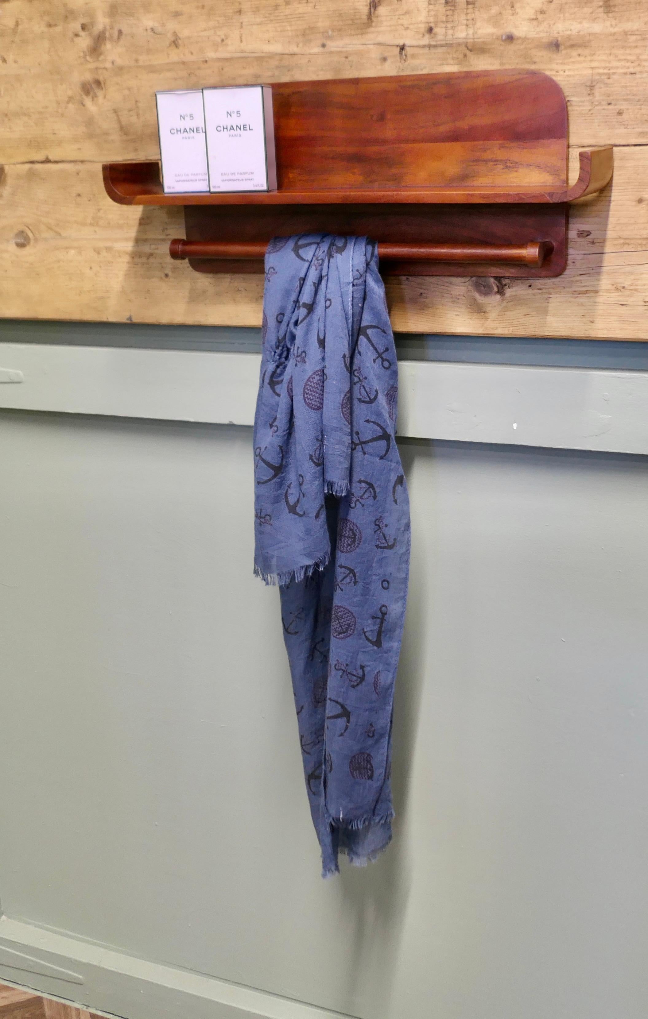 Mid Century Vanity Wall Shelf with Rail

A very stylish and useful piece craftsman made in teak, and simple to fit on a wall, the shelf is 9” high, 24” long and 5” deep
WE245