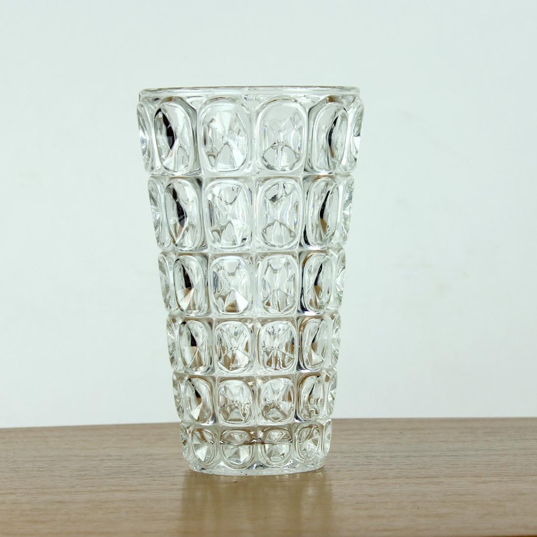 Beautiful glass vase in transparent pressed glass. Designed by František Pečený for Hermanova hut glass factory in 1963. Number of pattern 20040.
Frantisek Pečený was one of the most significant glass designers in 1960s in Czechoslovakia. He was