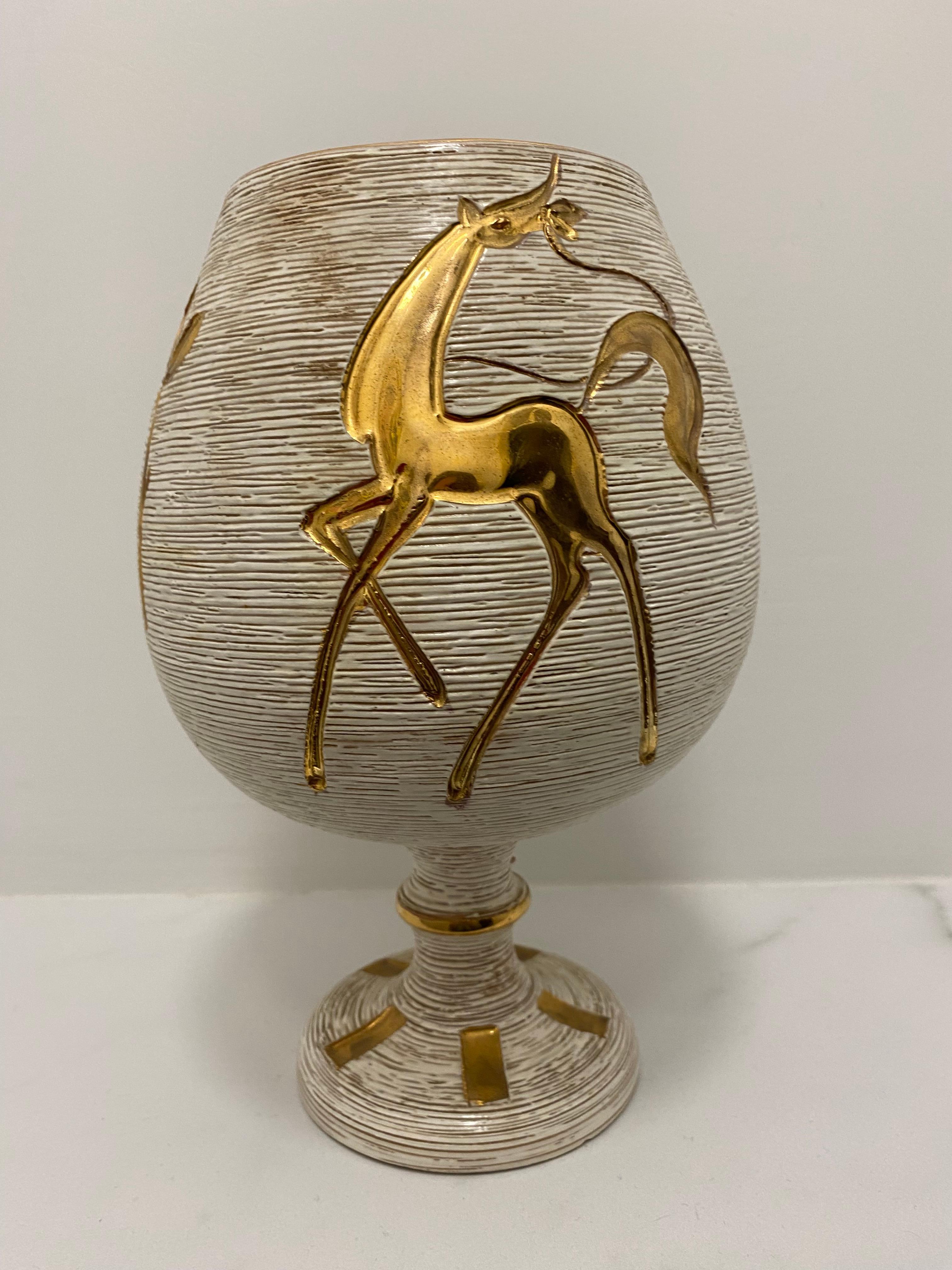 Stunning and stylish, 26cm high, vase with sgrafitto and hand-painted golden glossy pattern.  The pattern of the horse is painted at the front and at the back. On the base is painted Italy 2101. 

Fratelli Fanciullacci Pottery: during the first half