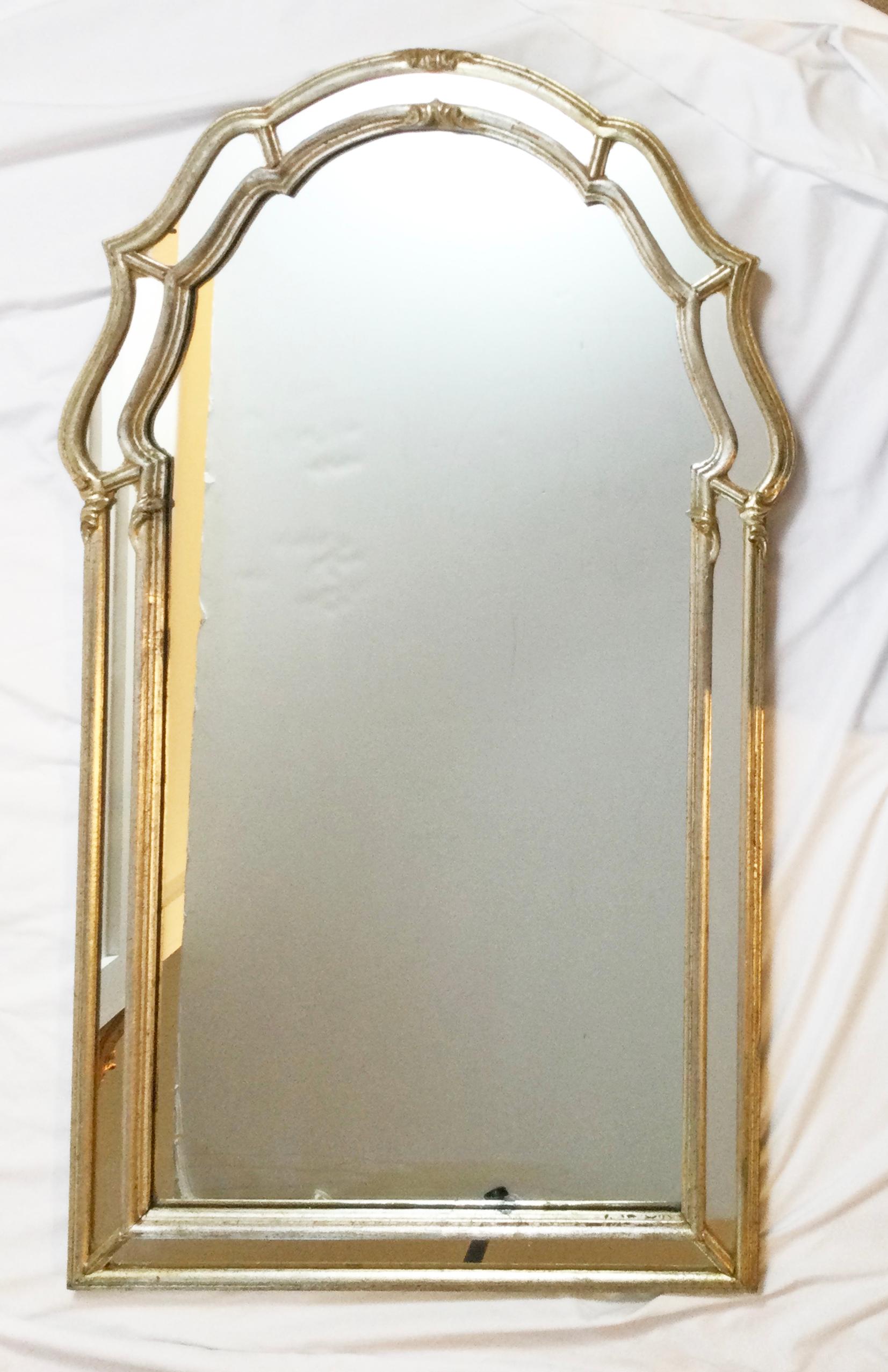 Mid-Century Venetian style silver leaf mirror; Mfg. for Schultz & Berhle. Good original condition with age appropriate wear.
Dimensions: 44