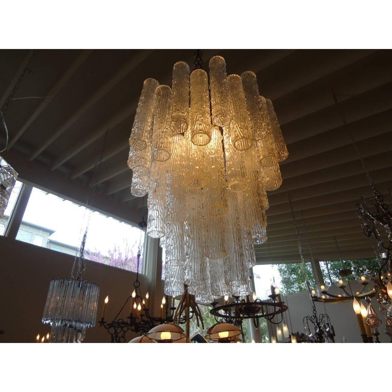 Midcentury tubular murano glass chandelier, murano glass pendant or Murano glass lantern in the style of Venini, circa 1960. This Murano chandelier can be suspended from a chain if extra length is needed. This Murano glass tronchi glass chandelier
