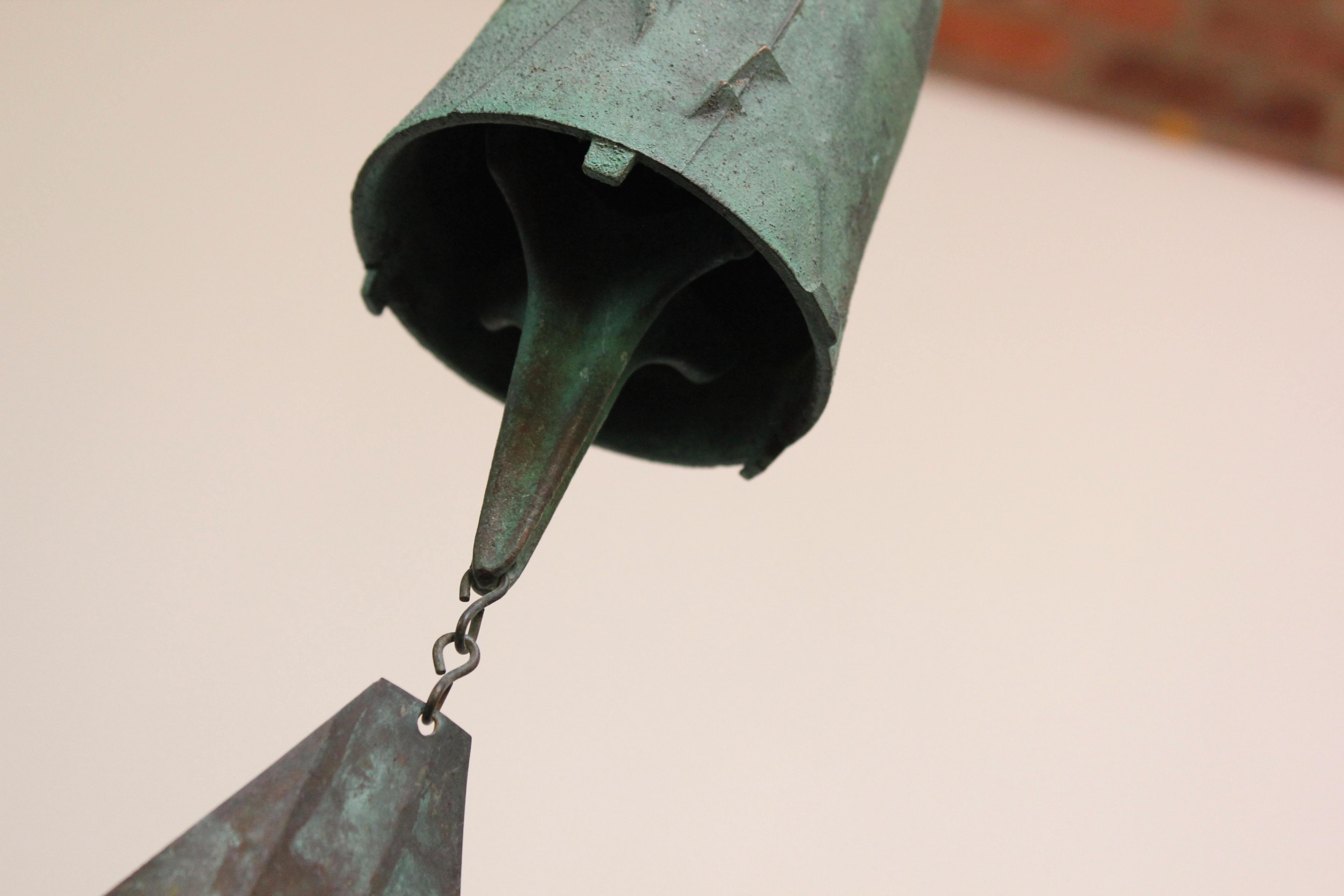 Impressive wind chime / bell designed by architect, Paolo Soleri for Arconsanti (the city he designed and built in Arizona in 1970).
Bronze cast elements with verdigris patina throughout from natural age and environmental weathering. 
Branded with