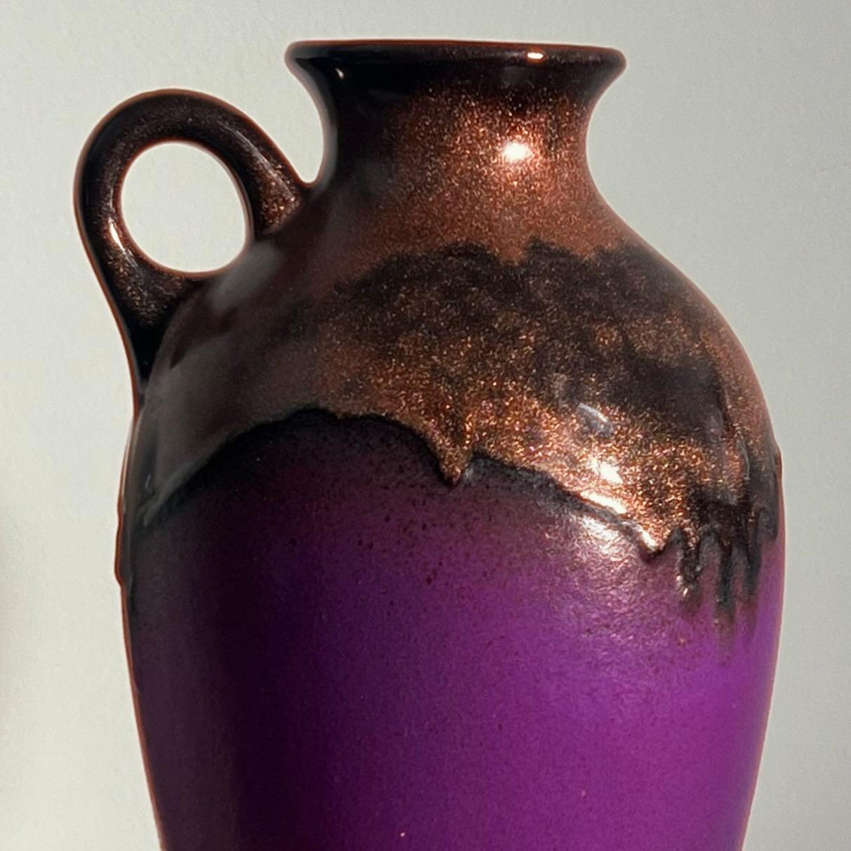 A large mid century ceramic vessel in electric purple by Fohr Keramik, West Germany 1960s. A vase, a jug, a pitcher - have it your way. Note the unique copper dribble along the neck of the vessel: Fohr began using a special glaze technique in the