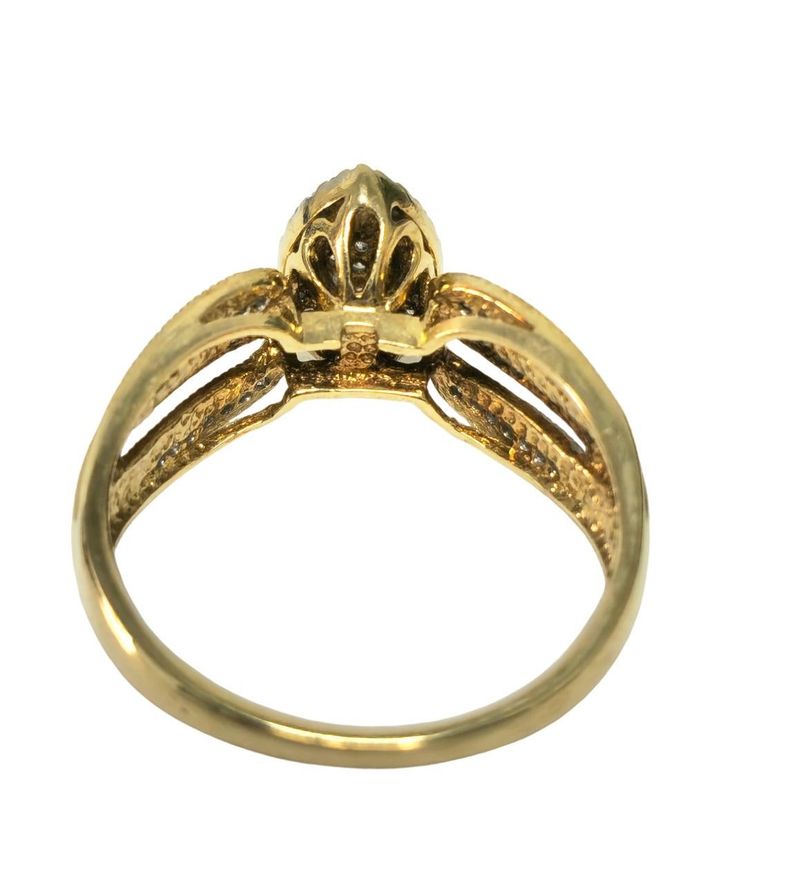 Indulge in timeless elegance with this vintage-inspired marquise motif diamond engagement ring, crafted from lustrous 10k yellow gold. The ring features a total of 1.20 carats of round-cut diamonds, each naturally mined from the earth, exhibiting