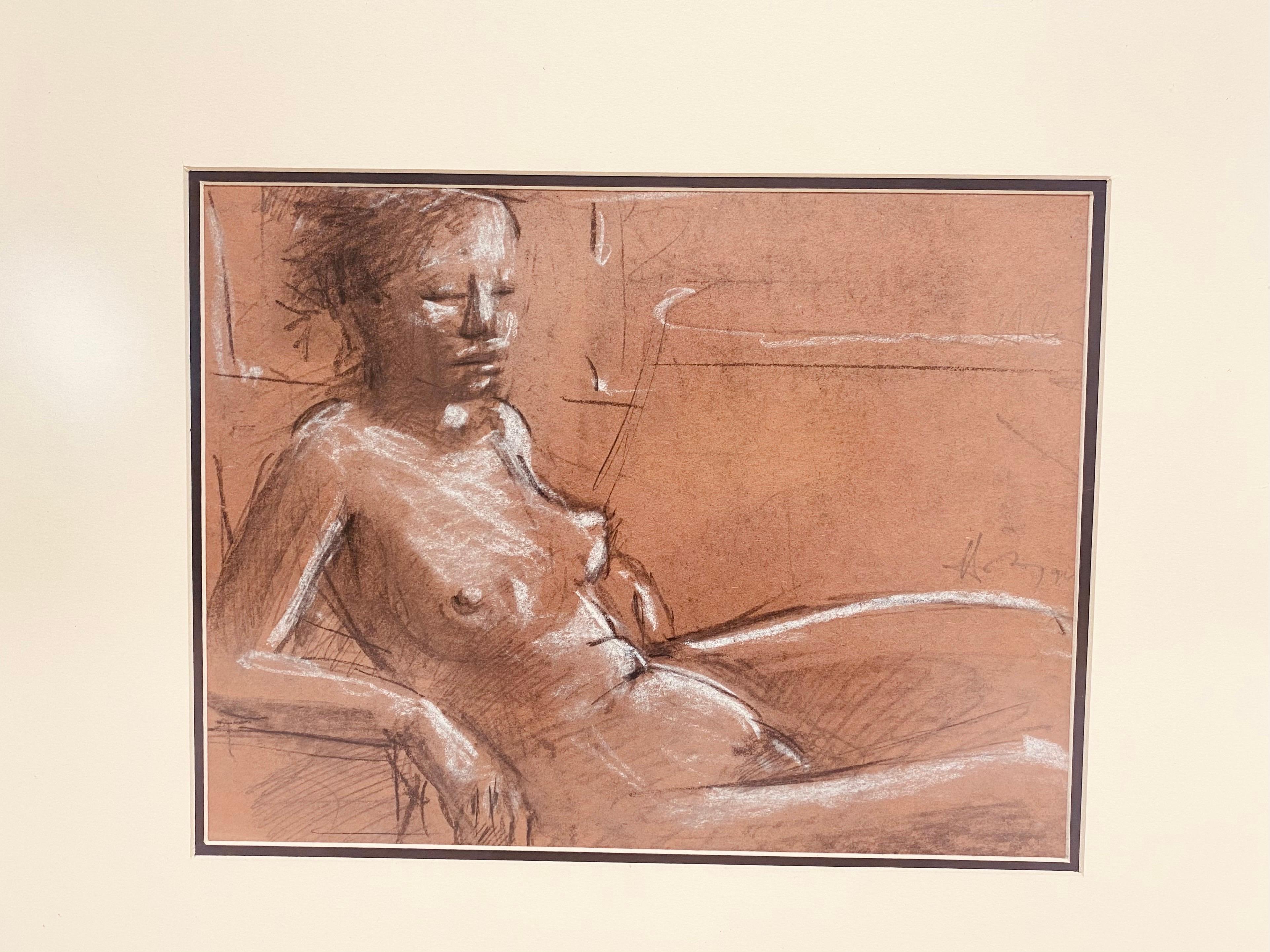 This is a mid century vintage female nude study in charcoal. This Academy style charcoal drawing is in a mid century pickled frame with cream and black mat boards. The charcoal drawing is in tones of cream and black on an amber colored paper.