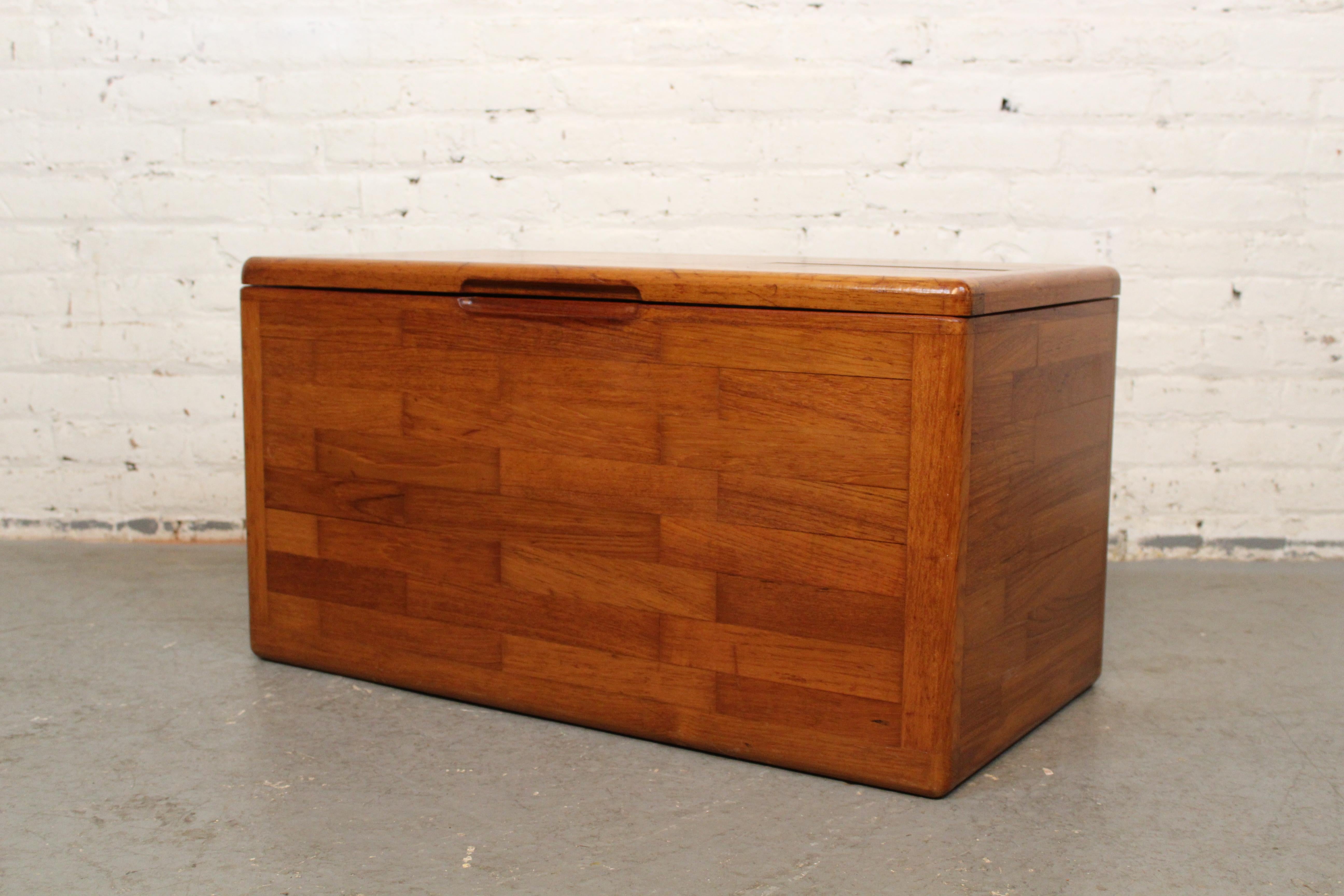 Add vintage charm to any room with this cheerful mid-century hope chest featuring a beautiful butcher block construction. Made entirely of solid wood (appearing to be a mix of maple, oak, and teak) with pegged joinery- the patchwork of natural wood