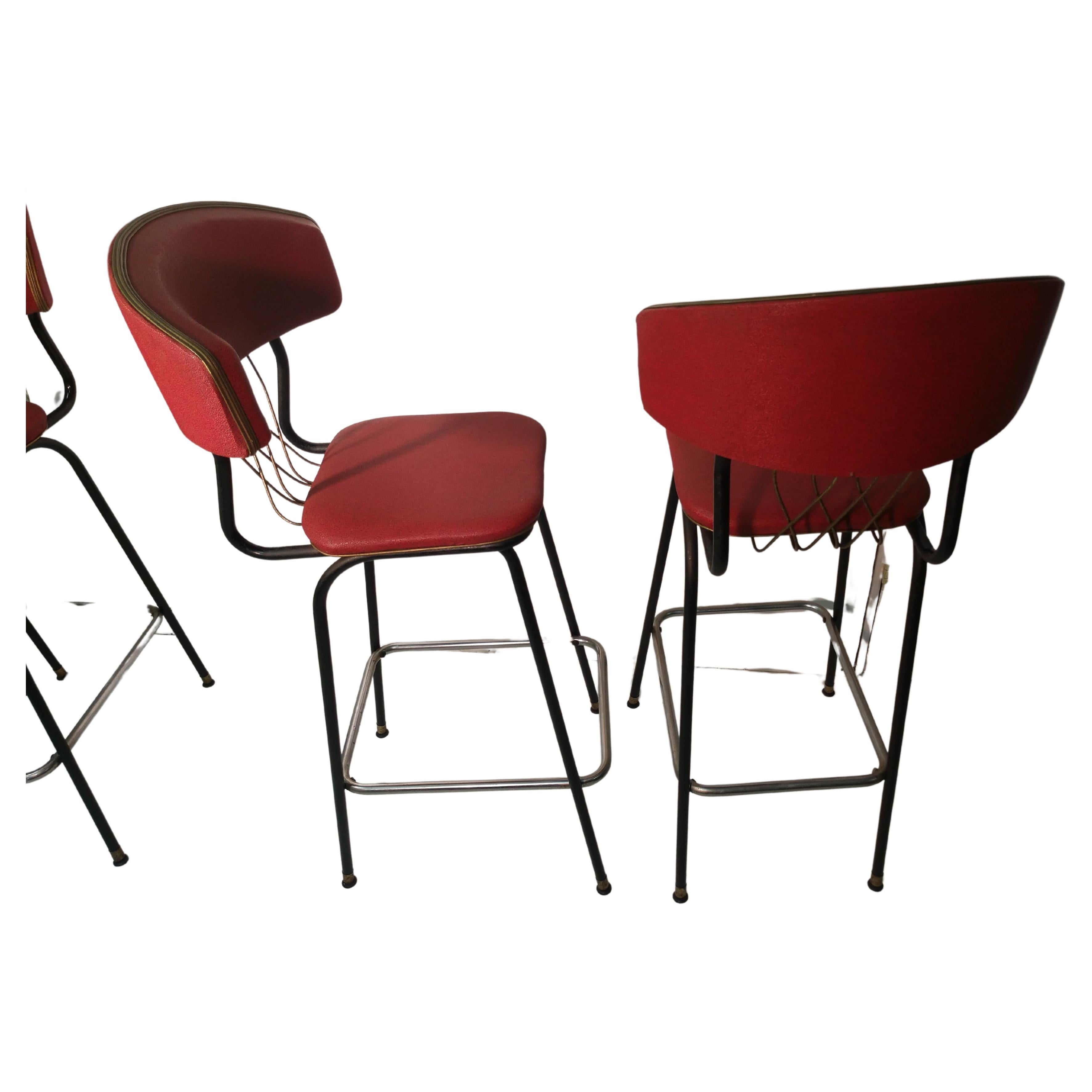 All original vintage vinyl material in overall excellent condition with a couple of minor blemishes. Pictured. Original feet on legs, very comfy contours to the backs and the chrome ring shows some wear but overall is very good. Brass wirework is