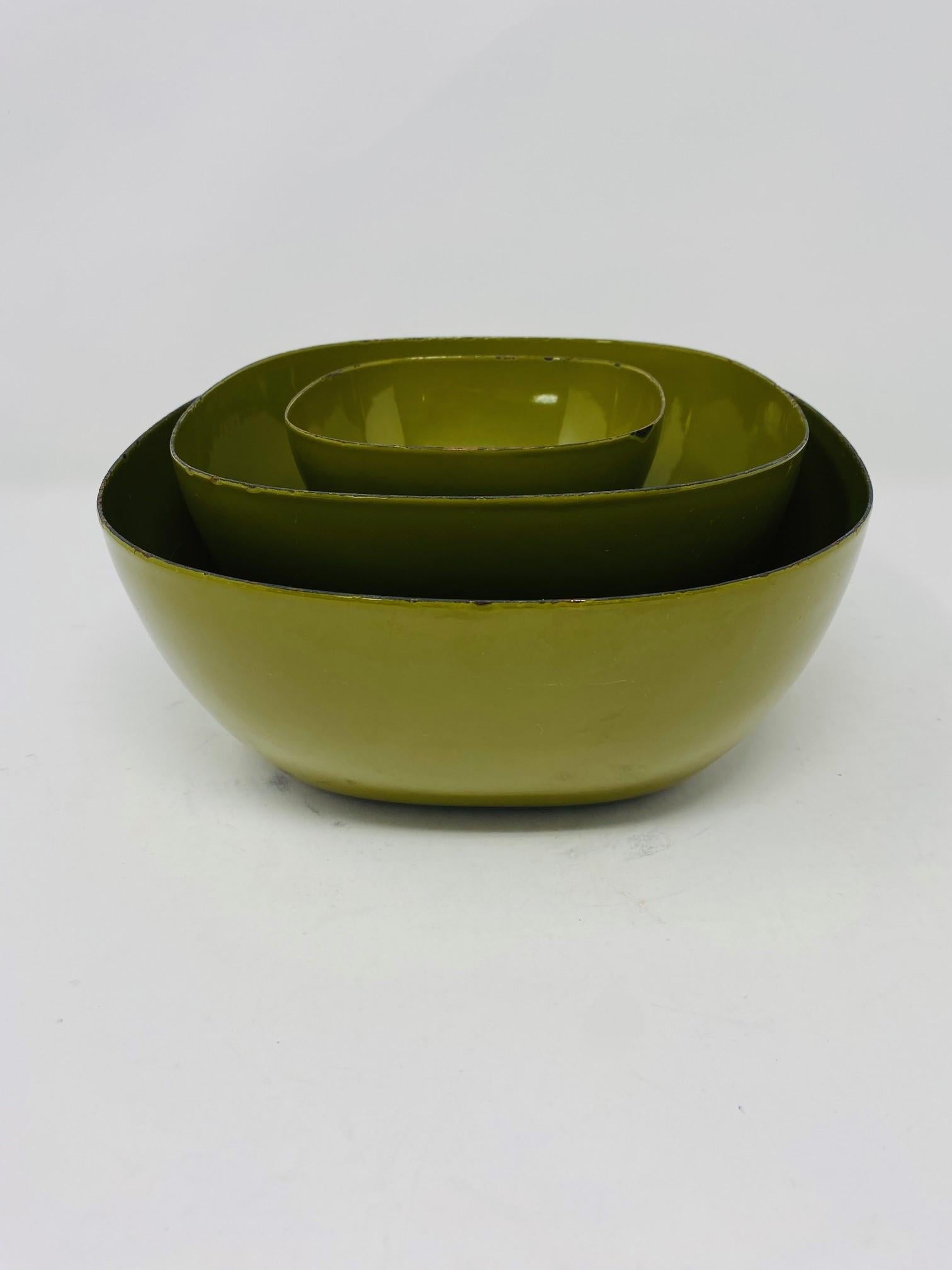 These Cathrineholm nesting bowls were manufactured in Holland for Graham Kerr, aka, The Galloping Gourmet. They are an avocado green color with a black edge that emphasizes the distinctive rounded square-shape design of that series.The bowls