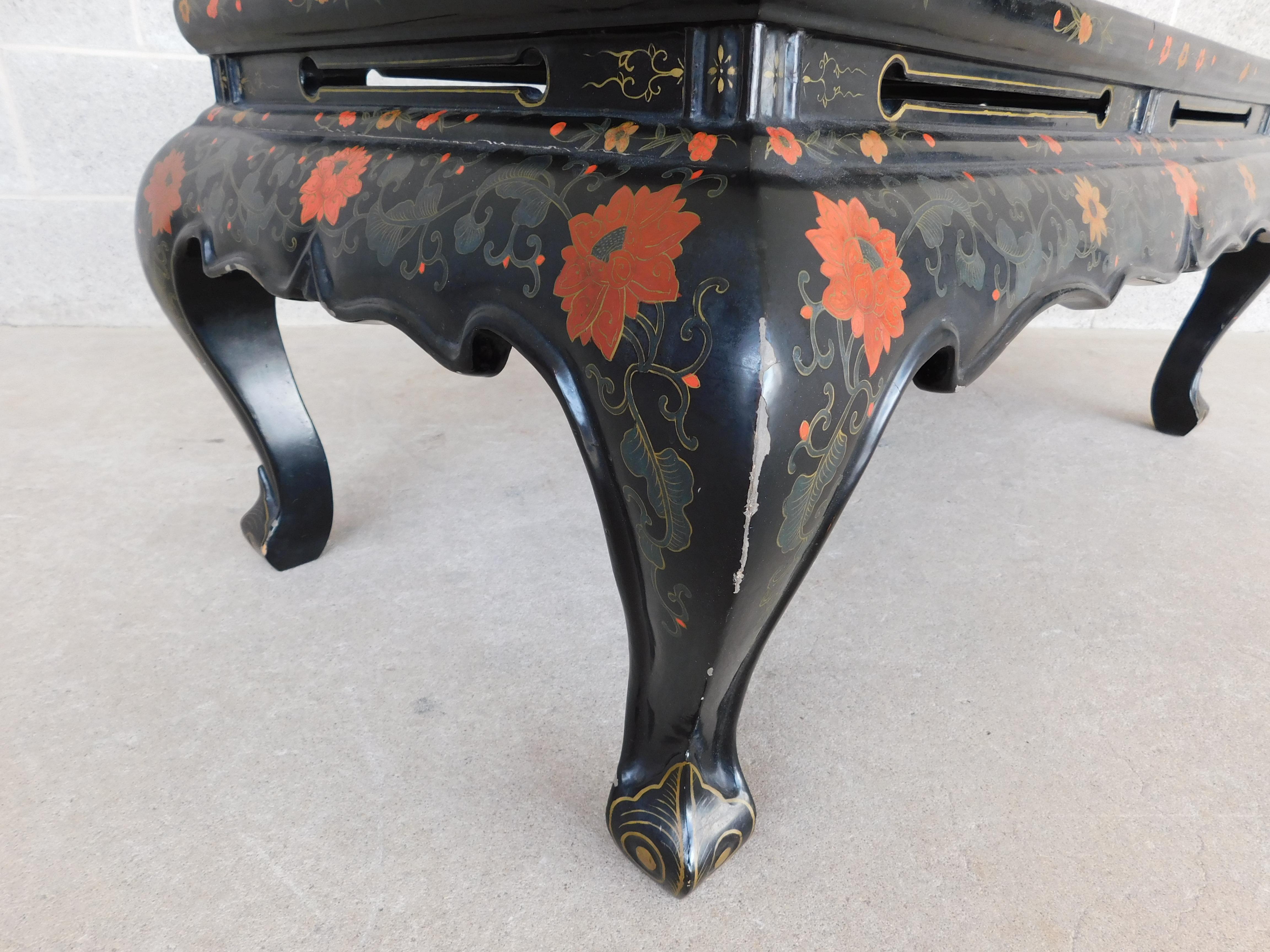 Peoples Republic of China midcentury vintage chinoiserie lacquered inlaid motif coffee table. Inlaid flowers, blossoms and vines, in vibrant blues, orange, white, with soft undertones of grays and soft reds. Hand painted accents, and pierced apron