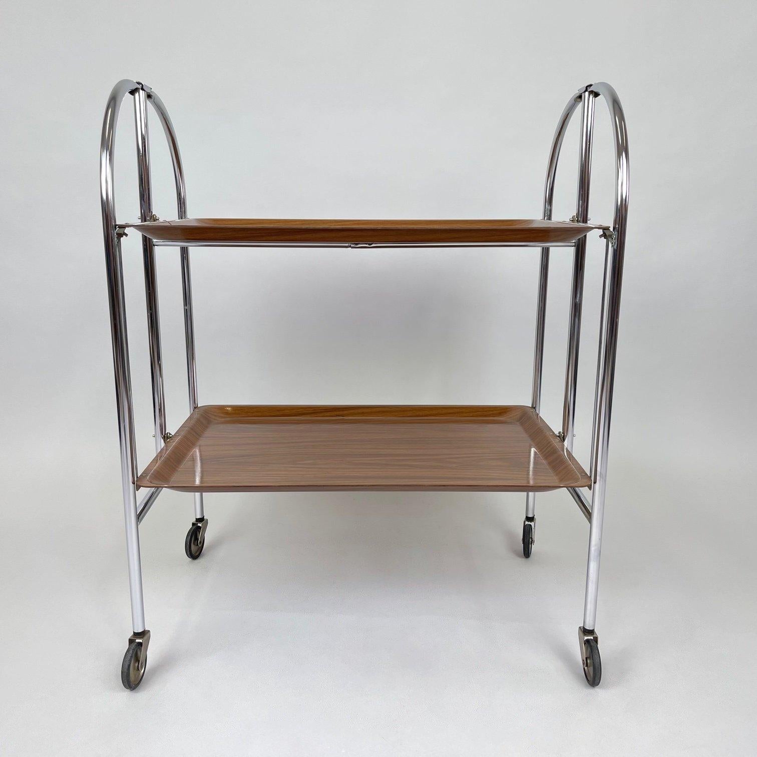 Mid-Century Modern, vintage serving tea cart consisting of moulded plywood and chrome. 
Produced in Germany in the 1950's.