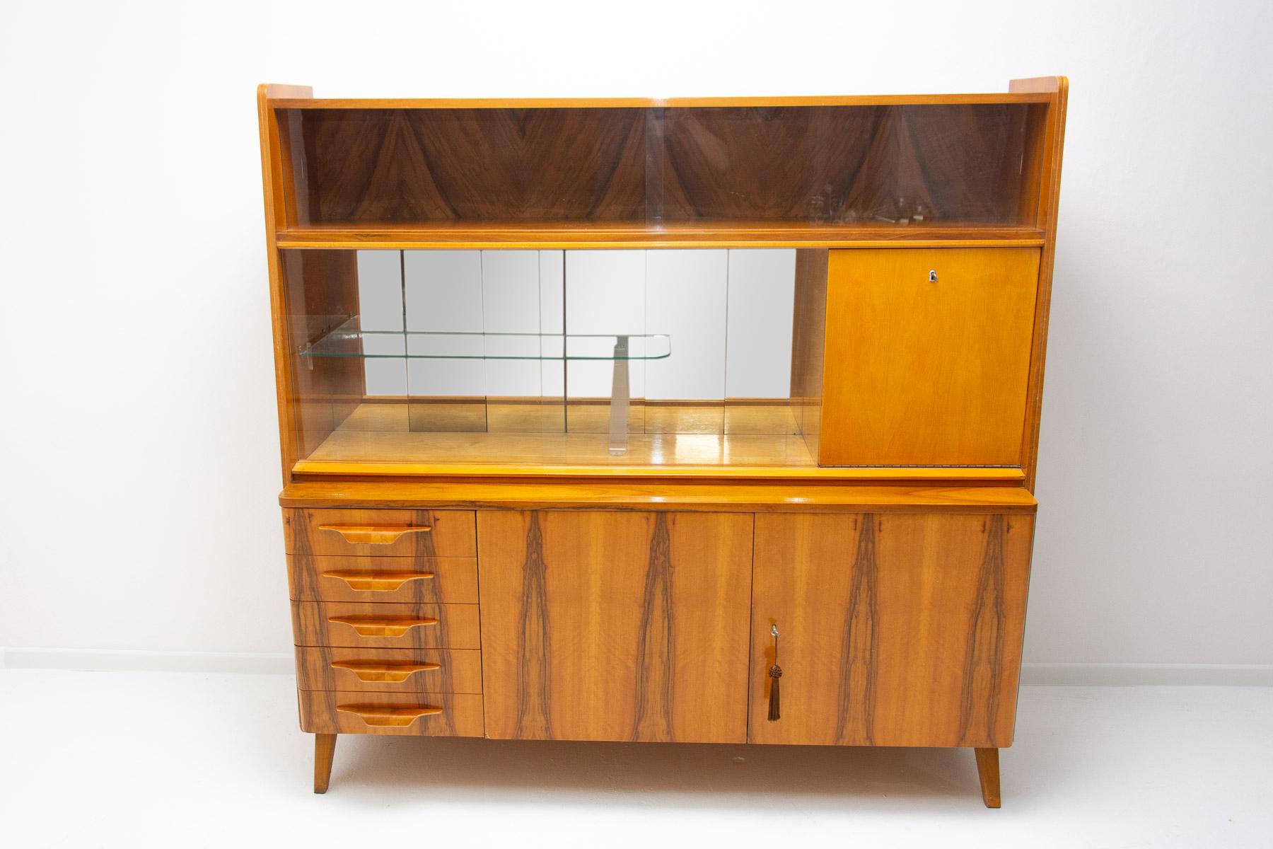 Mid century Vintage credenza or sideboard from the 1960´s. It was designed by František Jirák and was manufactured by Tatra nábytok company in the former Czechoslovakia. Features a simple design, a glazed section can be used as a bar, bookcase etc. 
