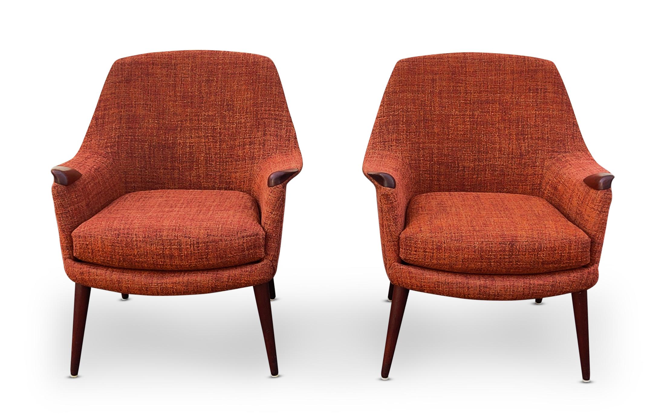 For your consideration, a pair of Danish made, Mid-Century Modern, 1960s, lounge or club chairs in the Style of Hans Wegner. Notice the careful contouring of every part of these chairs. Sculpted teak hand-rests. Tapering and angled vteak legs.