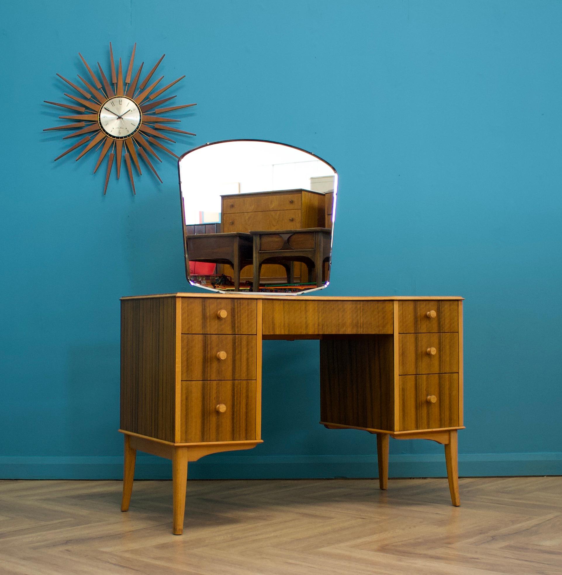 A beautiful quality walnut dressing table from Helas, circa 1950s
Featuring seven drawers
Height to the top of the mirror 136cm