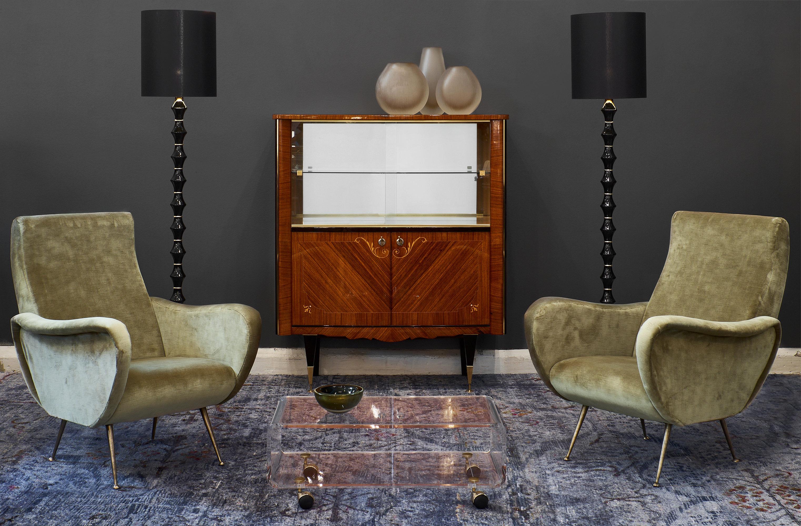 French Mid-Century vintage cabinet/bar featuring beautiful rosewood parquetry with satin wood marquetry. We love the tapered and ebonized legs with adjustable brass front feet. With its vitrine upper level behind glass doors, this refined piece