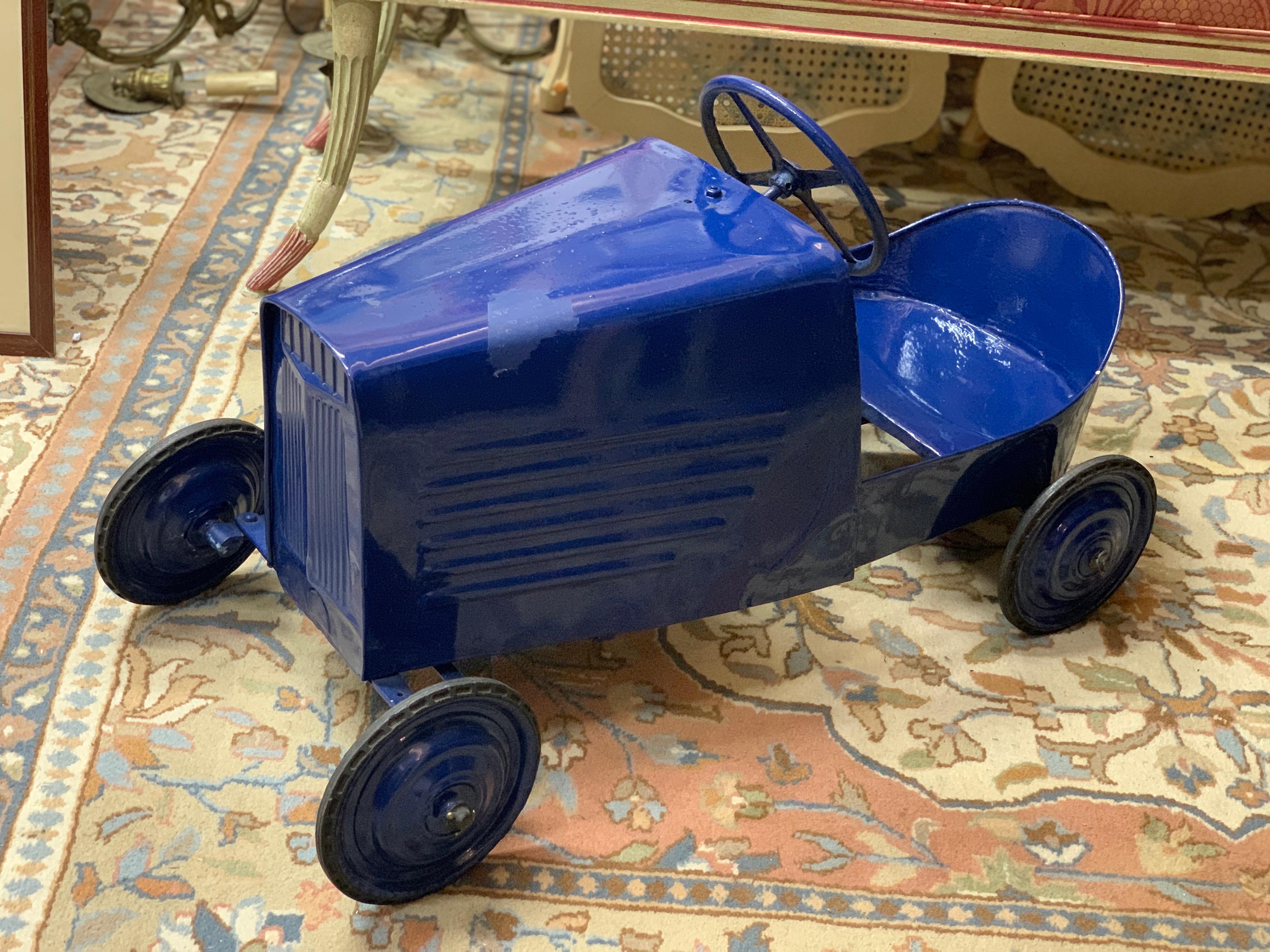 Stunning large sized vintage pedal car in blue azure. Very good condition with some traces of use and age.
France, circa 1950.
 