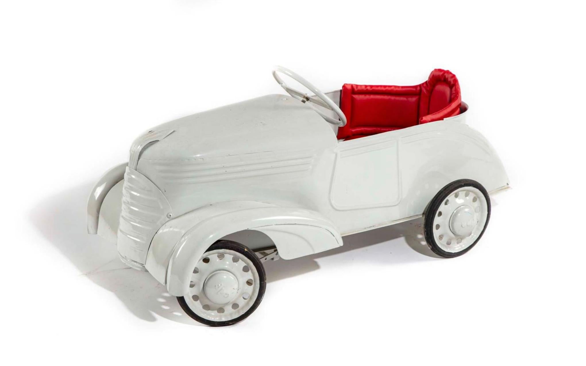 Rare large sized vintage pedal car in white metal with hot red seat. Very good condition.
France, circa 1950.
 