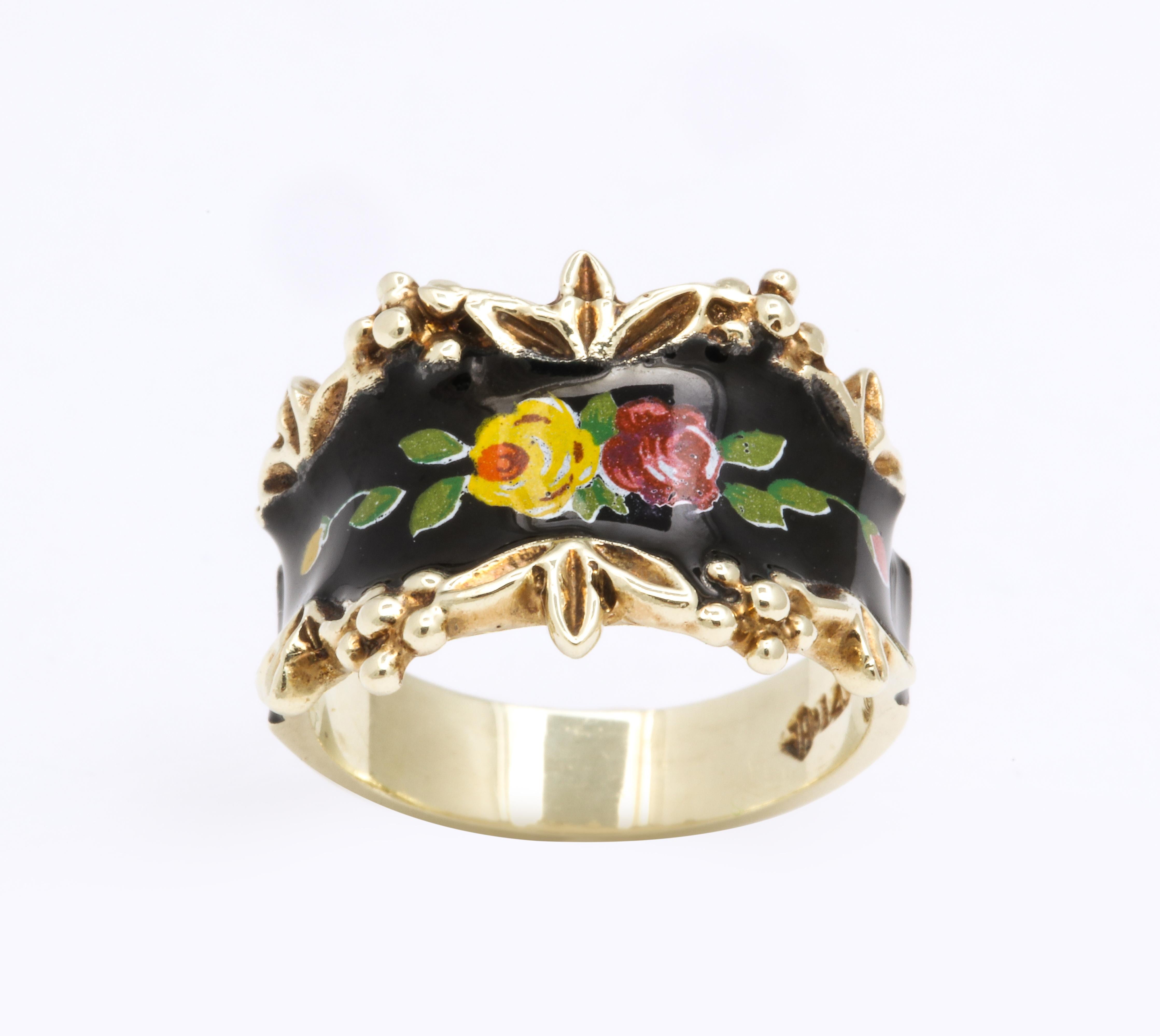 A romantic spray of roses and buds painted with enamel speaks to you on its 14 karat gold band.. The border of the enamel face is engraved with repousse, raised flowers and leaves.  The ring surprised me as I thought it was Victorian when I viewed