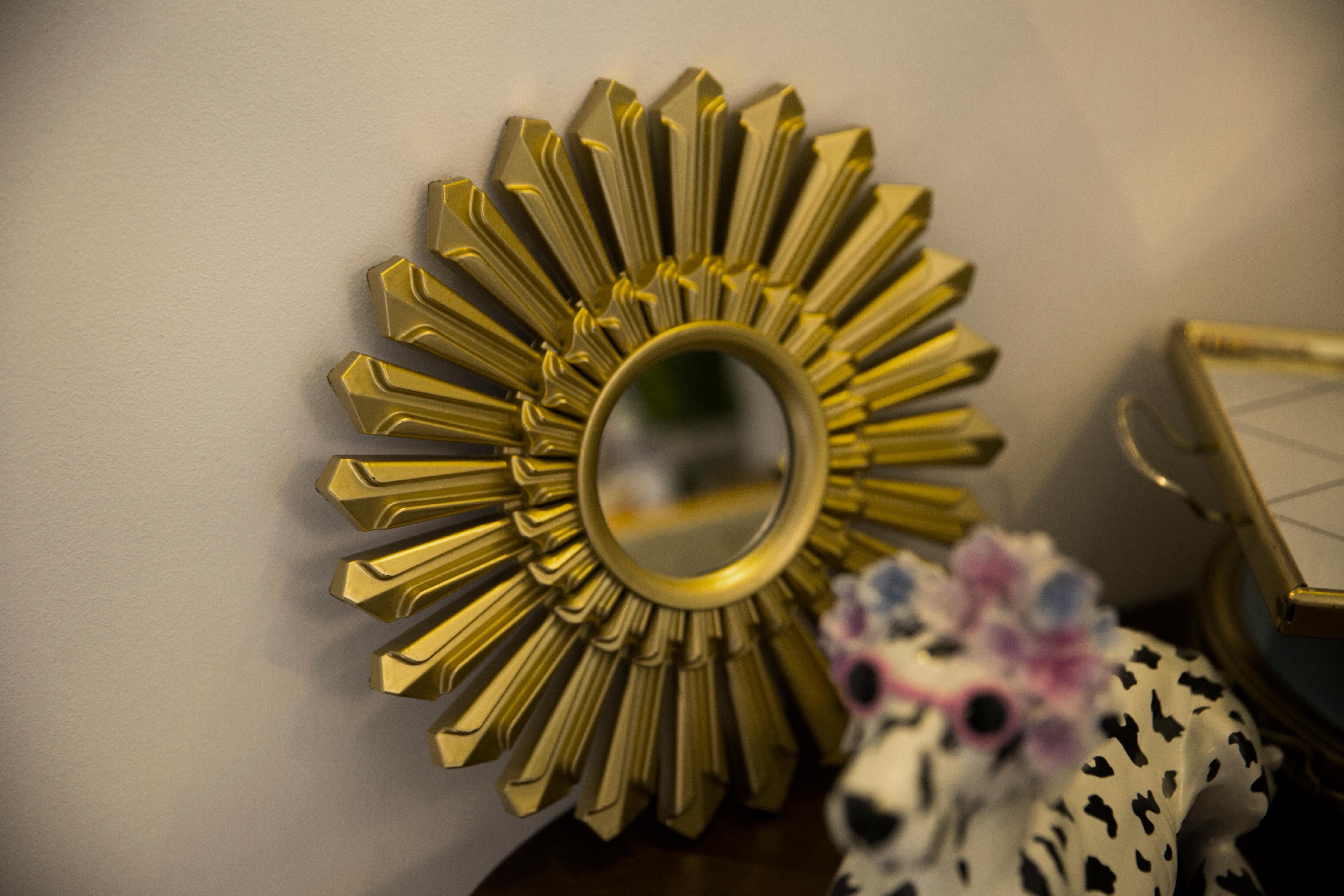 Vintage mirror in a golden decorative sun-shaped frame from Italy. The frame is made of plastic. Good original condition, no damage or cracks in the frame, the mirror pane has minimal flaws. Beautiful piece for every interior! Absolutely unique.