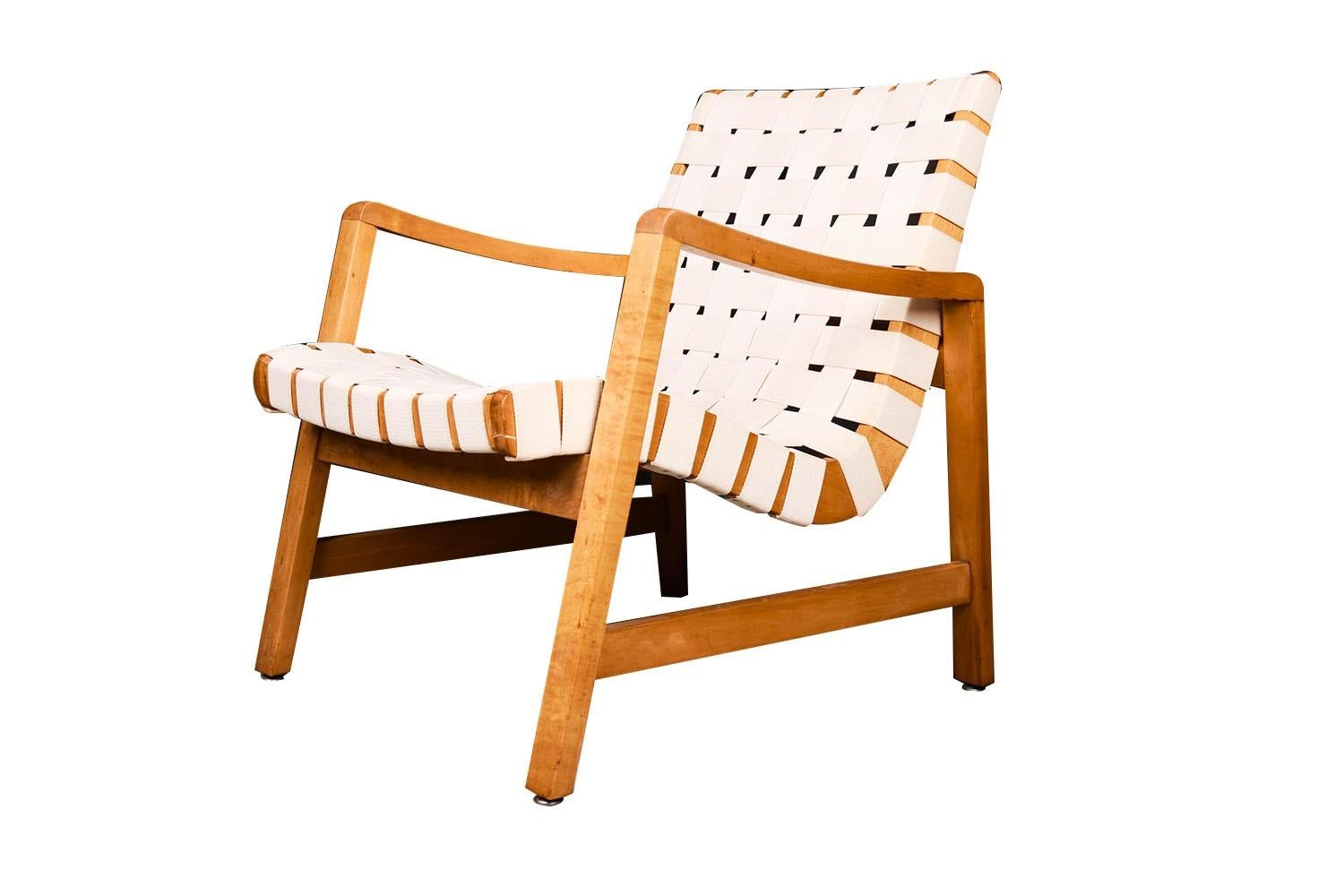 A stunning iconic cotton strap, webbed, lounge, armchair, 652W design (1943) early edition, designed by Jens Risom for Knoll International. Features a solid maple frame with original woven cotton straps. It is one of the most comfortable pieces you